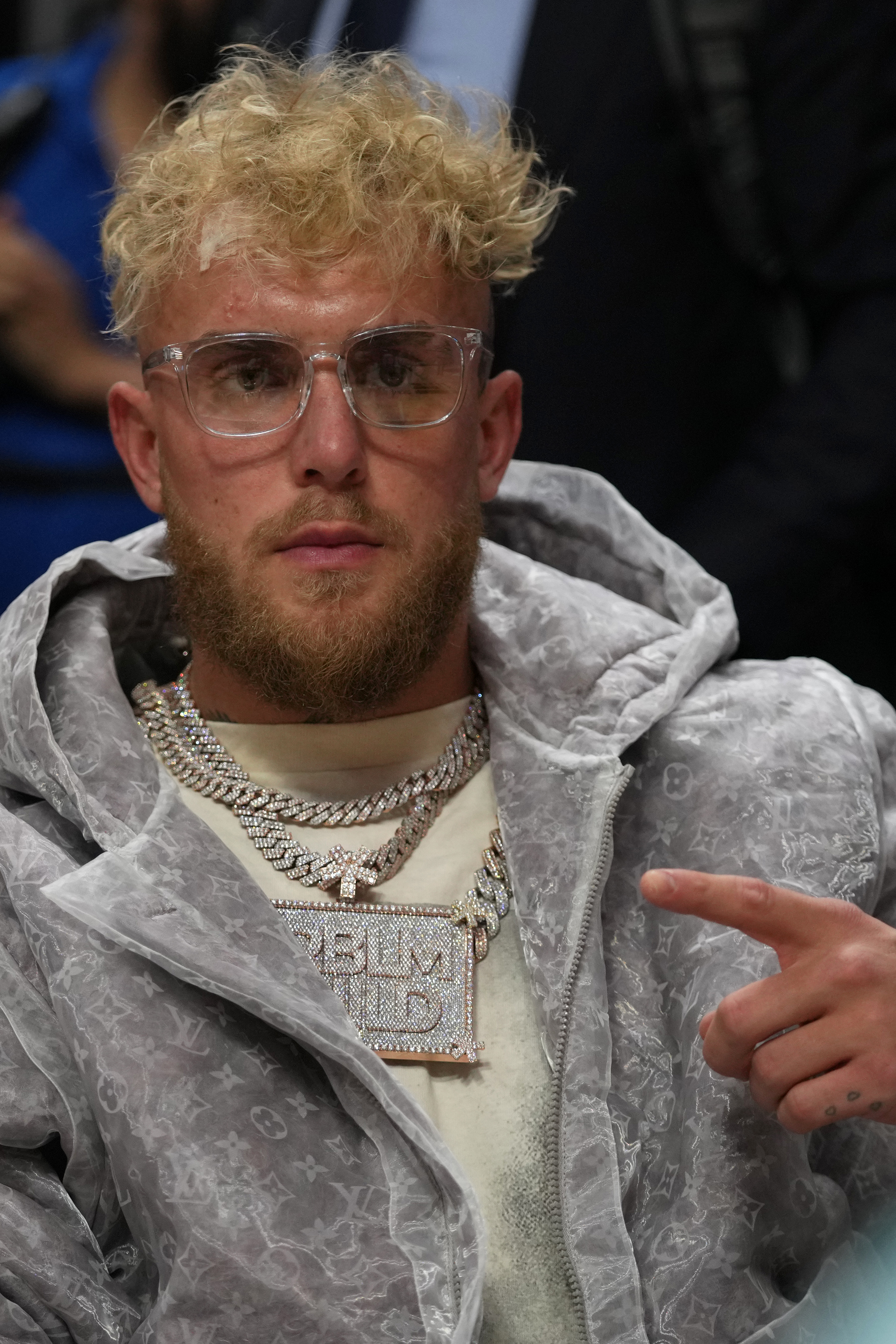 YouTube personality and boxer Jake Paul sits court-side during the second half between the Miami Heat and the Detroit Pistons at FTX Arena.