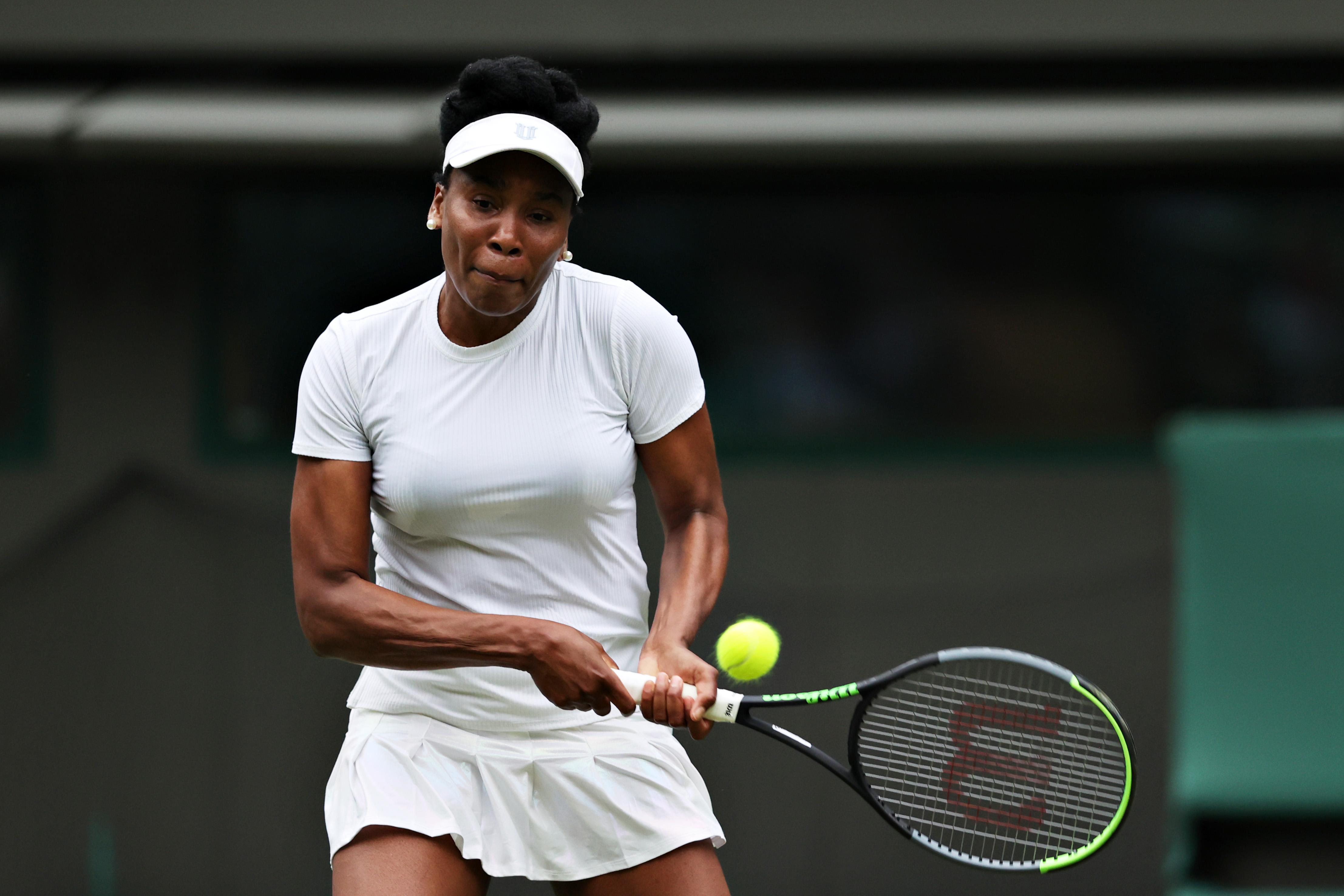 Venus Williams of The United States plays a backhand in her Ladies’ Singles Second Round match against Ons Jabeur of Tunisia during Day Three of The Championships - Wimbledon 2021 at All England Lawn Tennis and Croquet Club on June 30, 2021 in London, England.