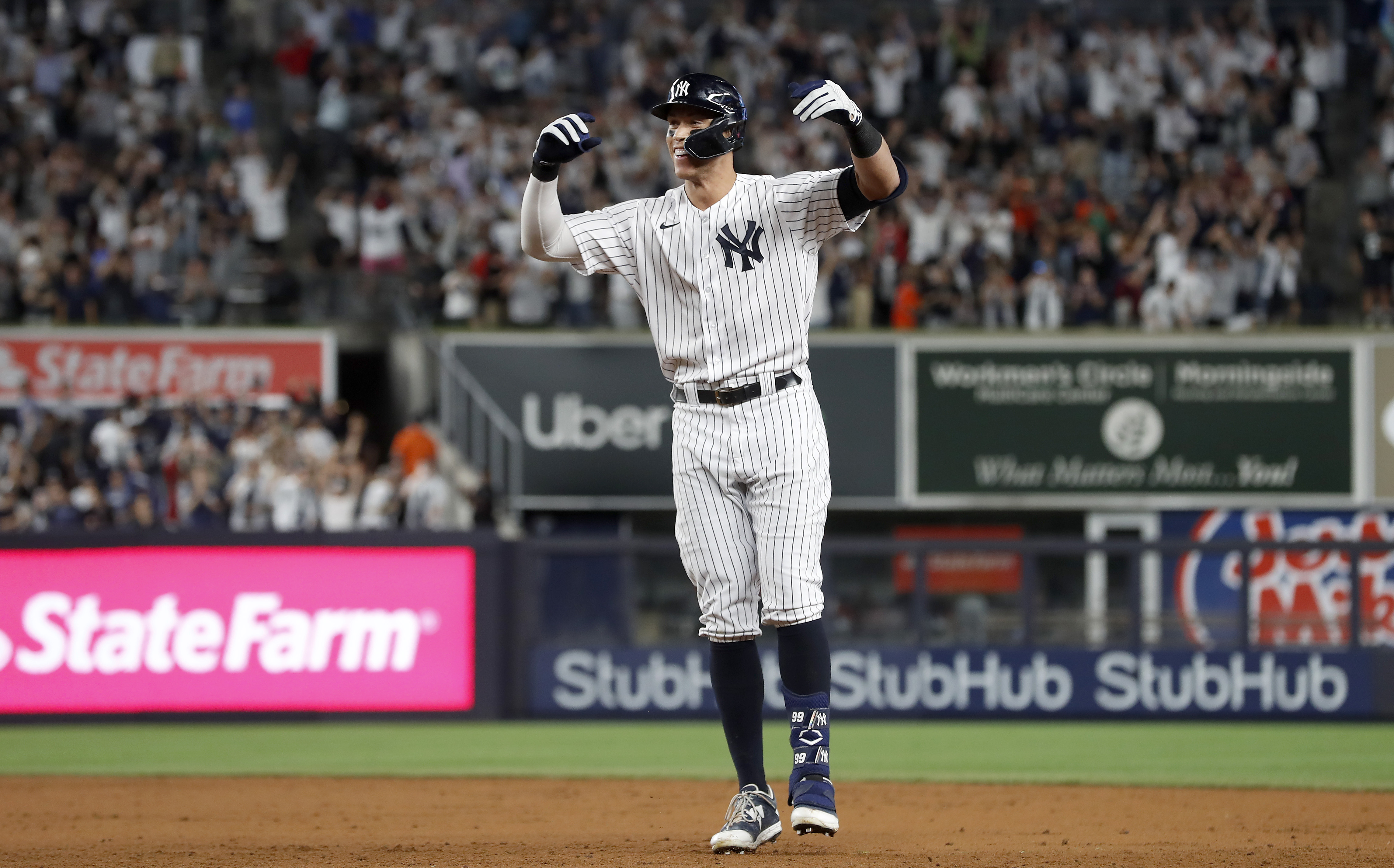 Aaron Judge #99 of the New York Yankees celebrates his ninth inning game winning base hit against the Houston Astros at Yankee Stadium on June 23, 2022 in New York City. The Yankees defeated the Astros 7-6.