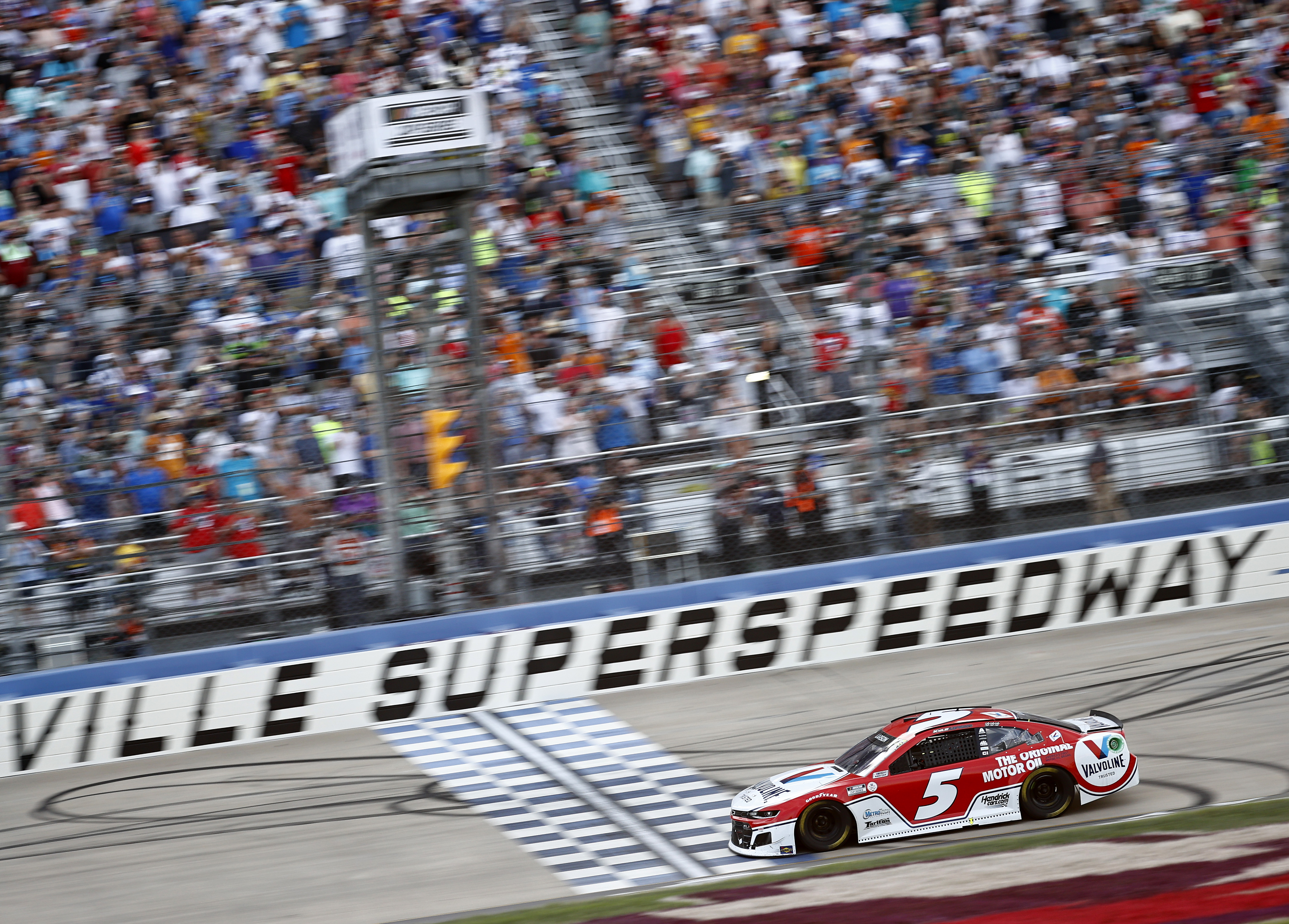 Kyle Larson, driver of the #5 Valvoline Chevrolet,crosses the finish line to win the NASCAR Cup Series Ally 400 at Nashville Superspeedway on June 20, 2021 in Lebanon, Tennessee.