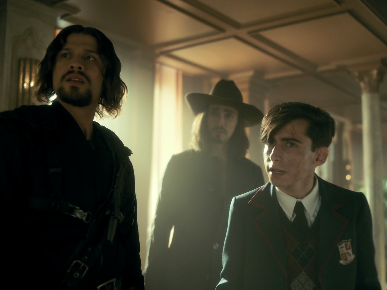 Diego, Klaus, and Five look quizzically ahead in an image from The Umbrella Academy season 3.
