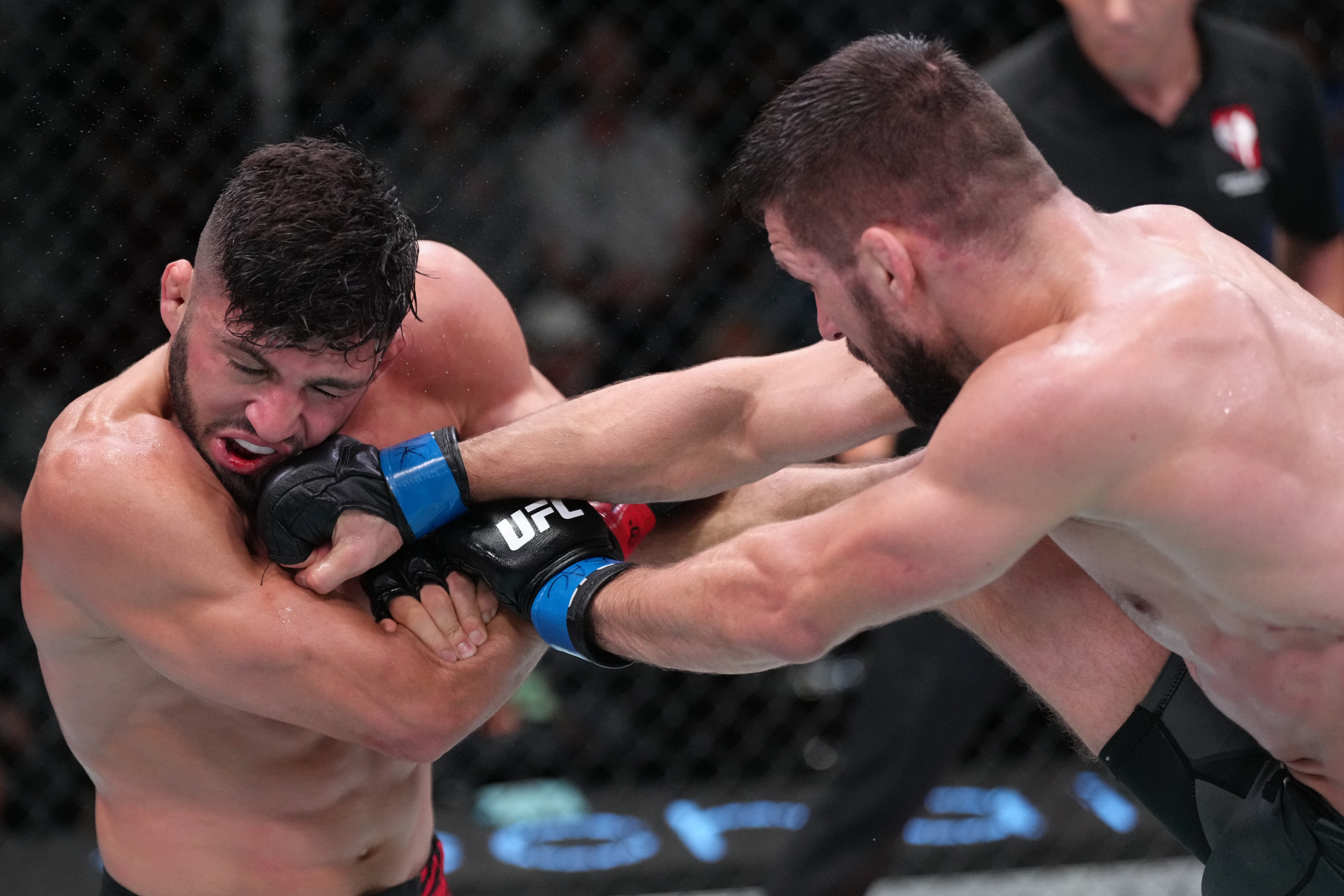 Mateusz Gamrot punches Arman Tsarukyan in the UFC Vegas 57 main event.