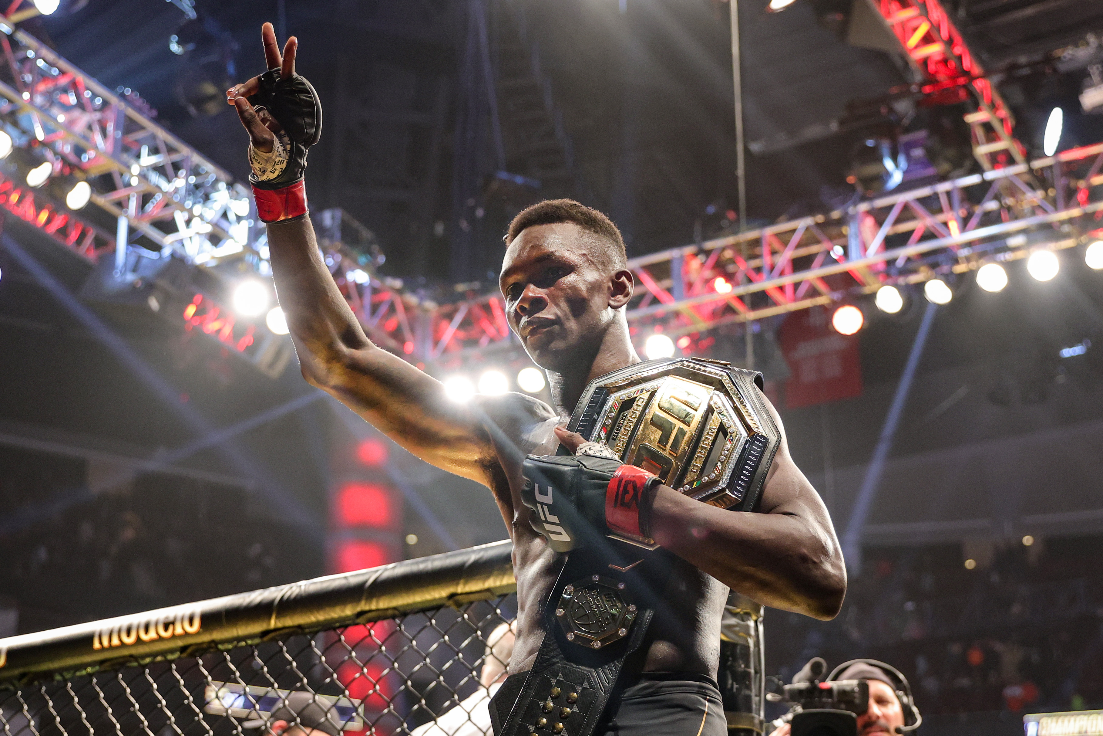 Israel Adesanya of Nigeria celebrates after defending his middleweight championship against Robert Whittaker of Australia during UFC 271 at Toyota Center on February 12, 2022 in Houston, Texas.