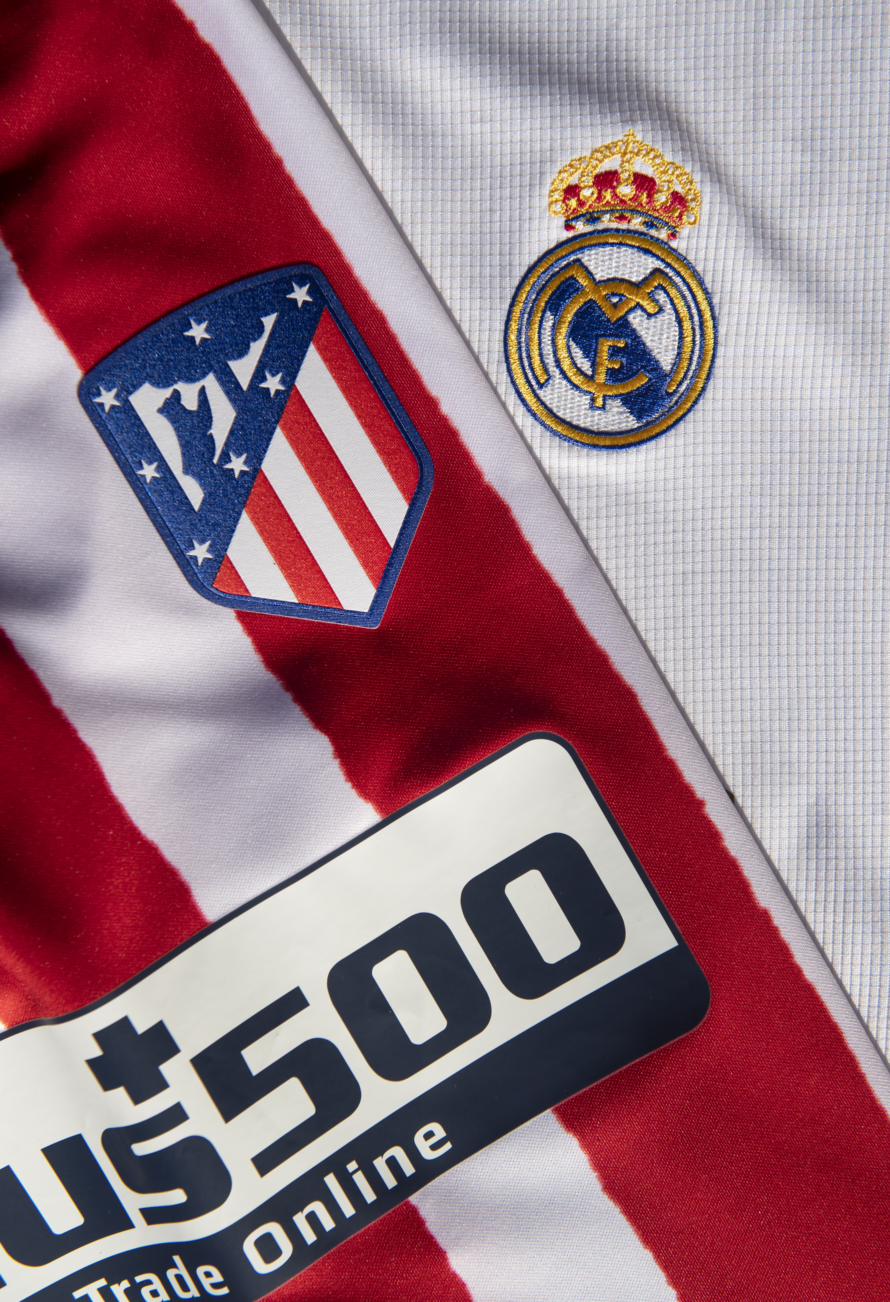 The Atletico Madrid and Real Madrid Badges