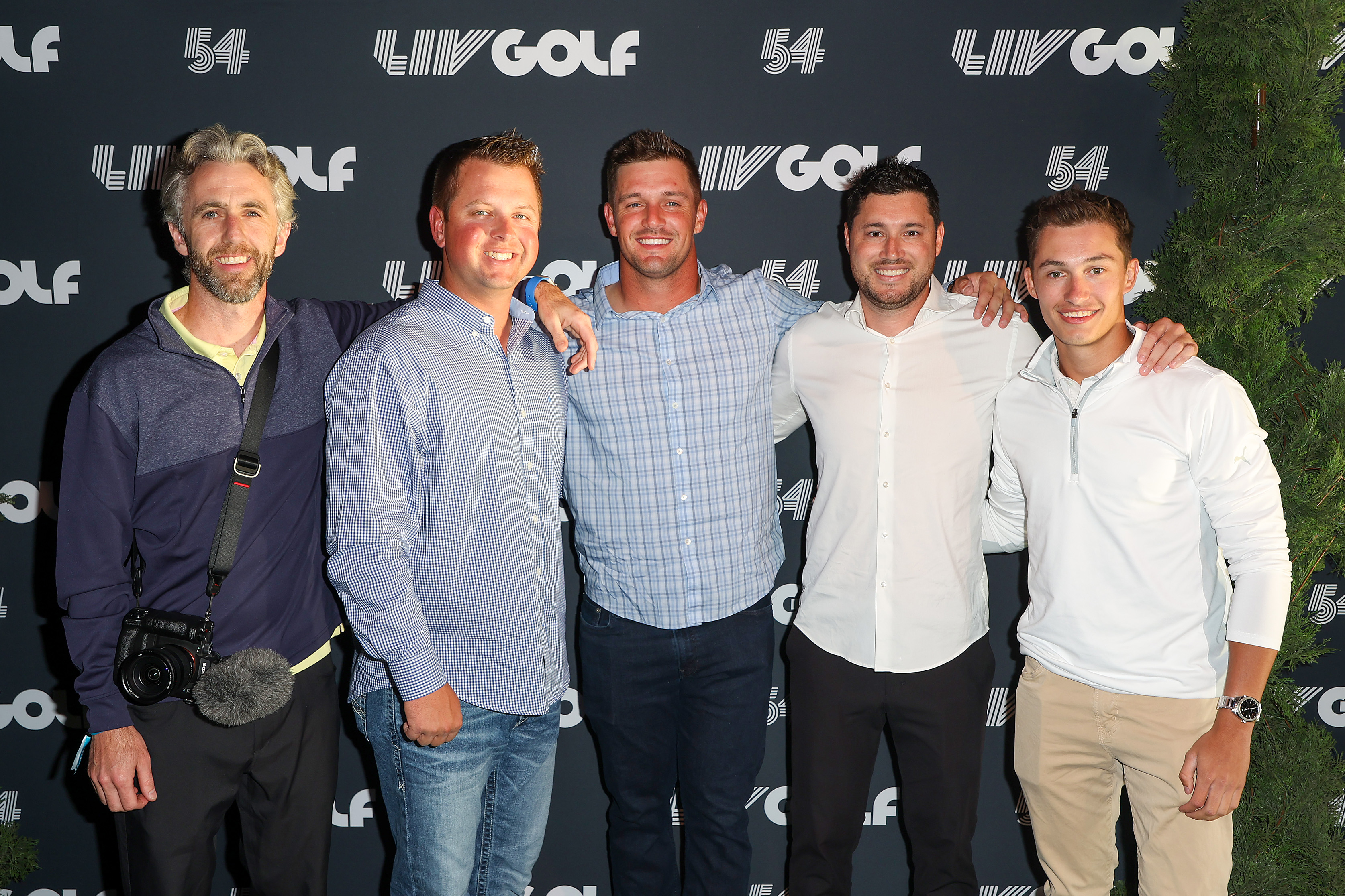 Bryson DeChambeau of Crushers GC smiles with guests during the LIV Golf Invitational - Portland Welcome Party at Redd on June 28, 2022 in Portland, Oregon.