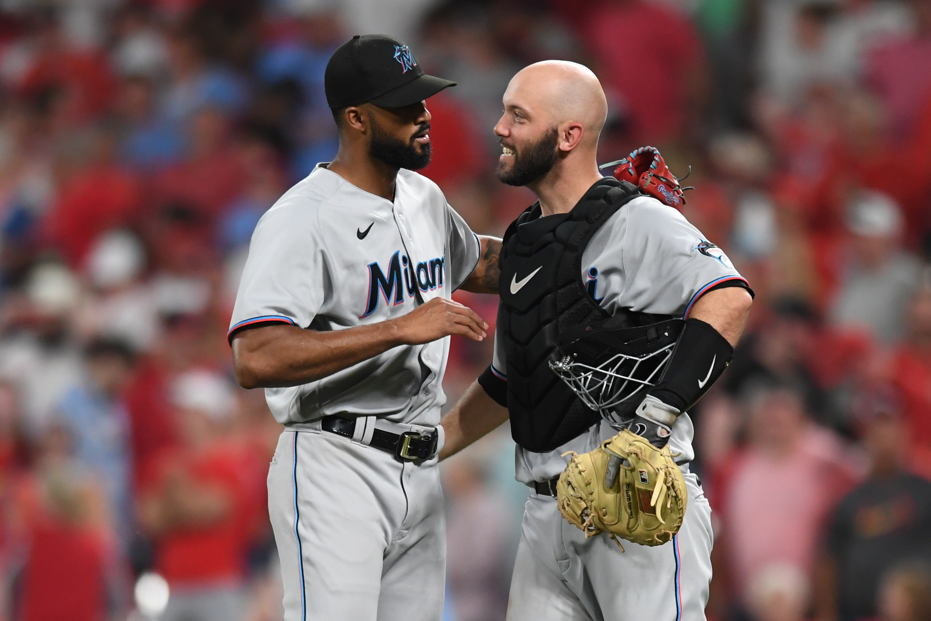Sandy Alcantara #22 and Jacob Stallings #58 of the Miami Marlins celebrate after defeating the St. Louis Cardinals 4-3 at Busch Stadium on June 29, 2022 in St Louis, Missouri.