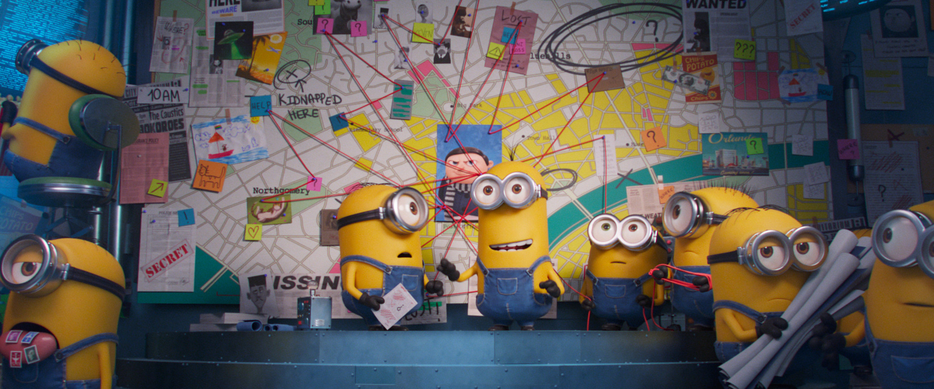 the minions standing in front of a conspiracy board