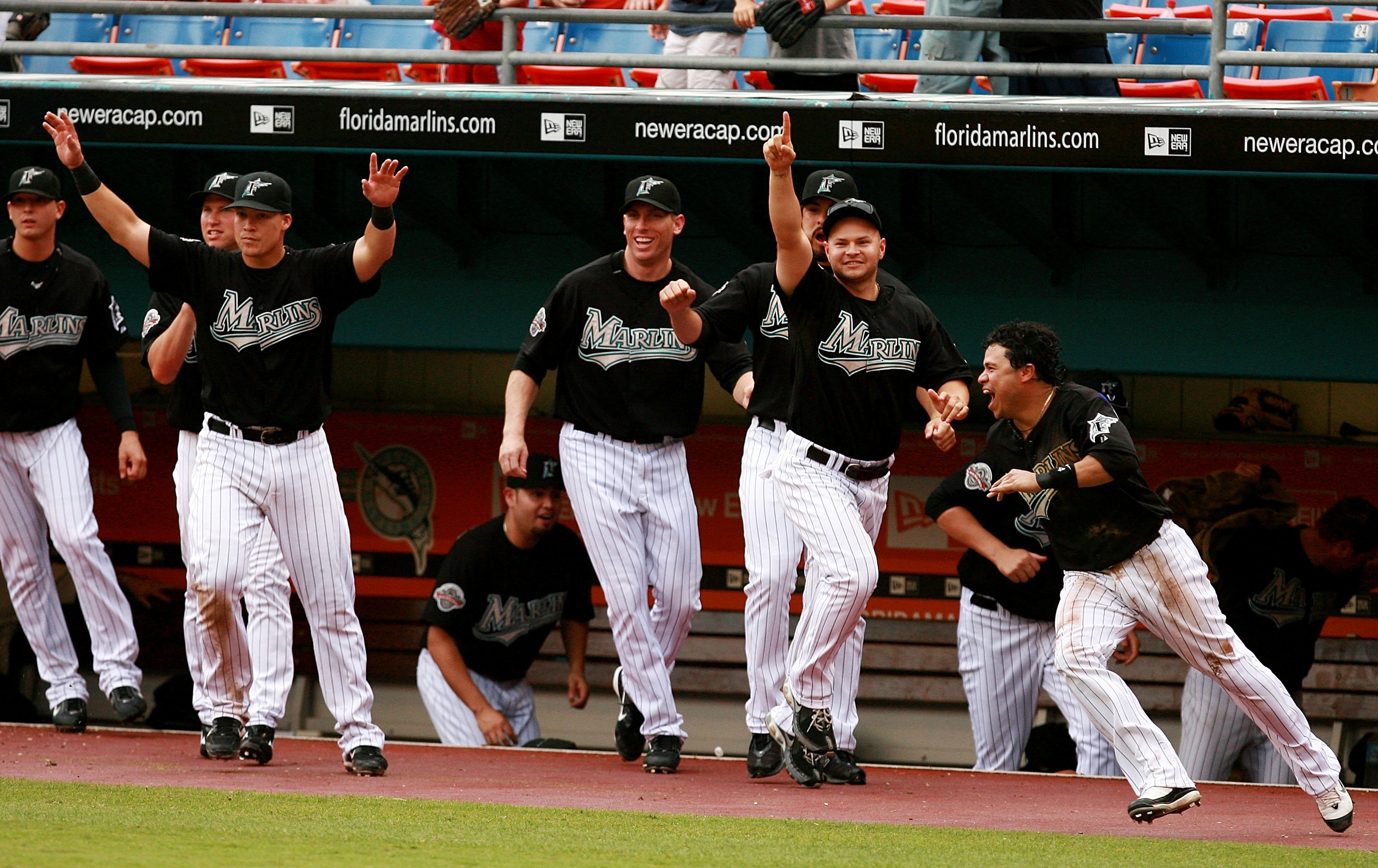 The bench of the Florida Marlins celebrates a game-winning hit by Josh Willingham #14 in the tenth inning against the Atlanta Braves at Dolphin Stadium July 1, 2007 in Miami, Florida.