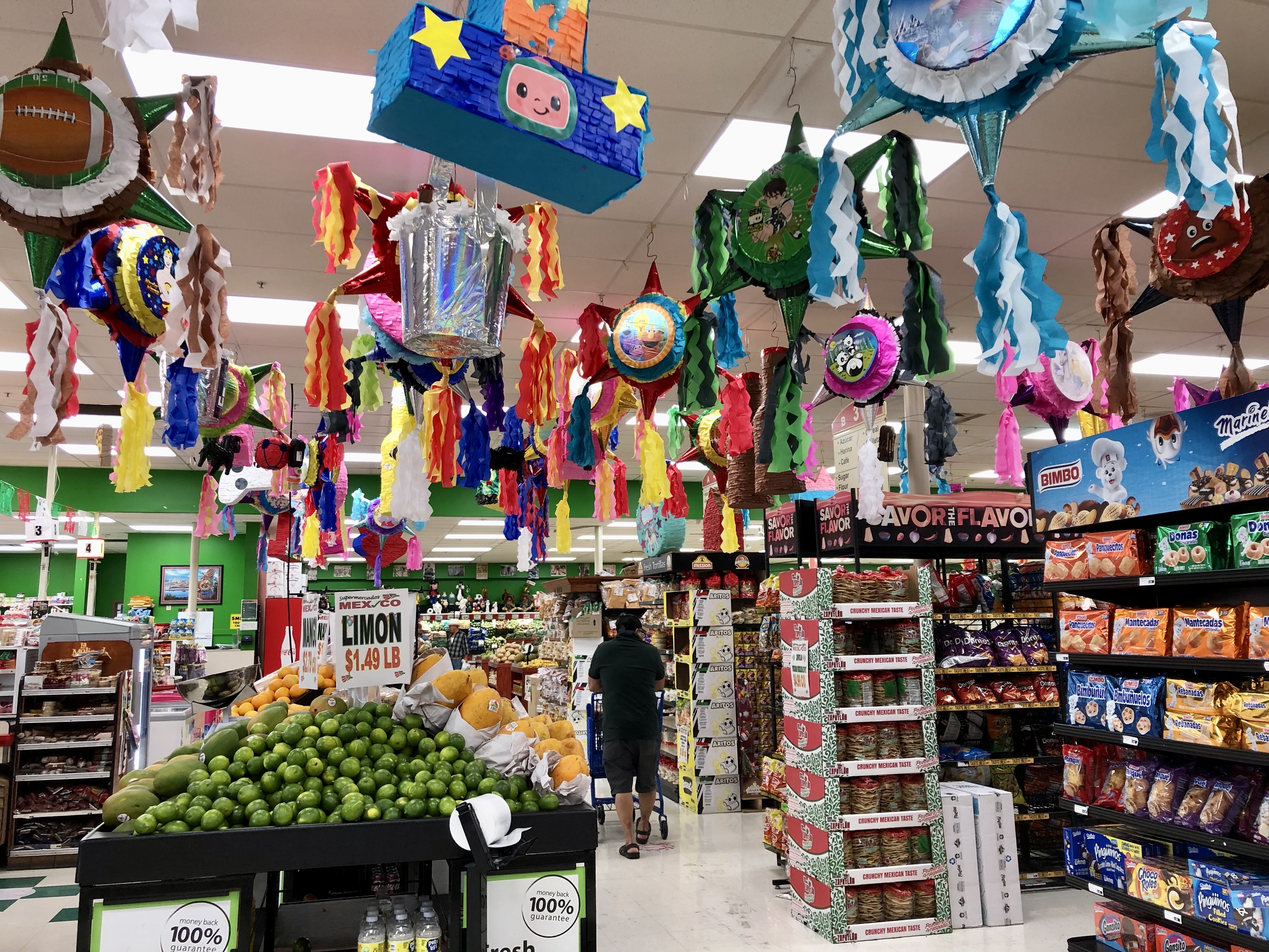 Pinatas hang from the ceiling of Supermercados Mexico.