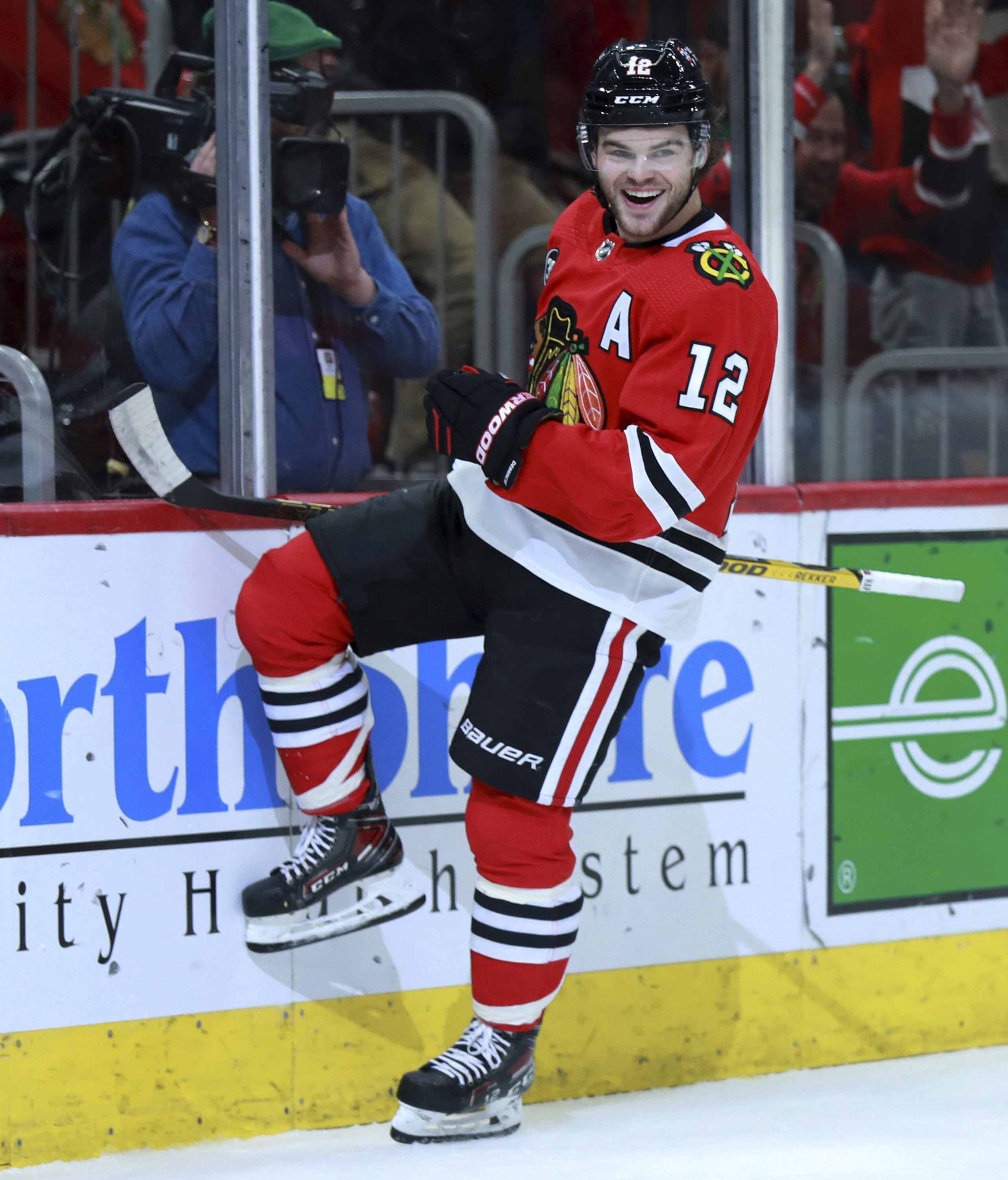 Chicago Blackhawks left wing Alex DeBrincat (12) celebrates after scoring in the first period against the Anaheim Ducks at the United Center, March 8, 2022, in Chicago.