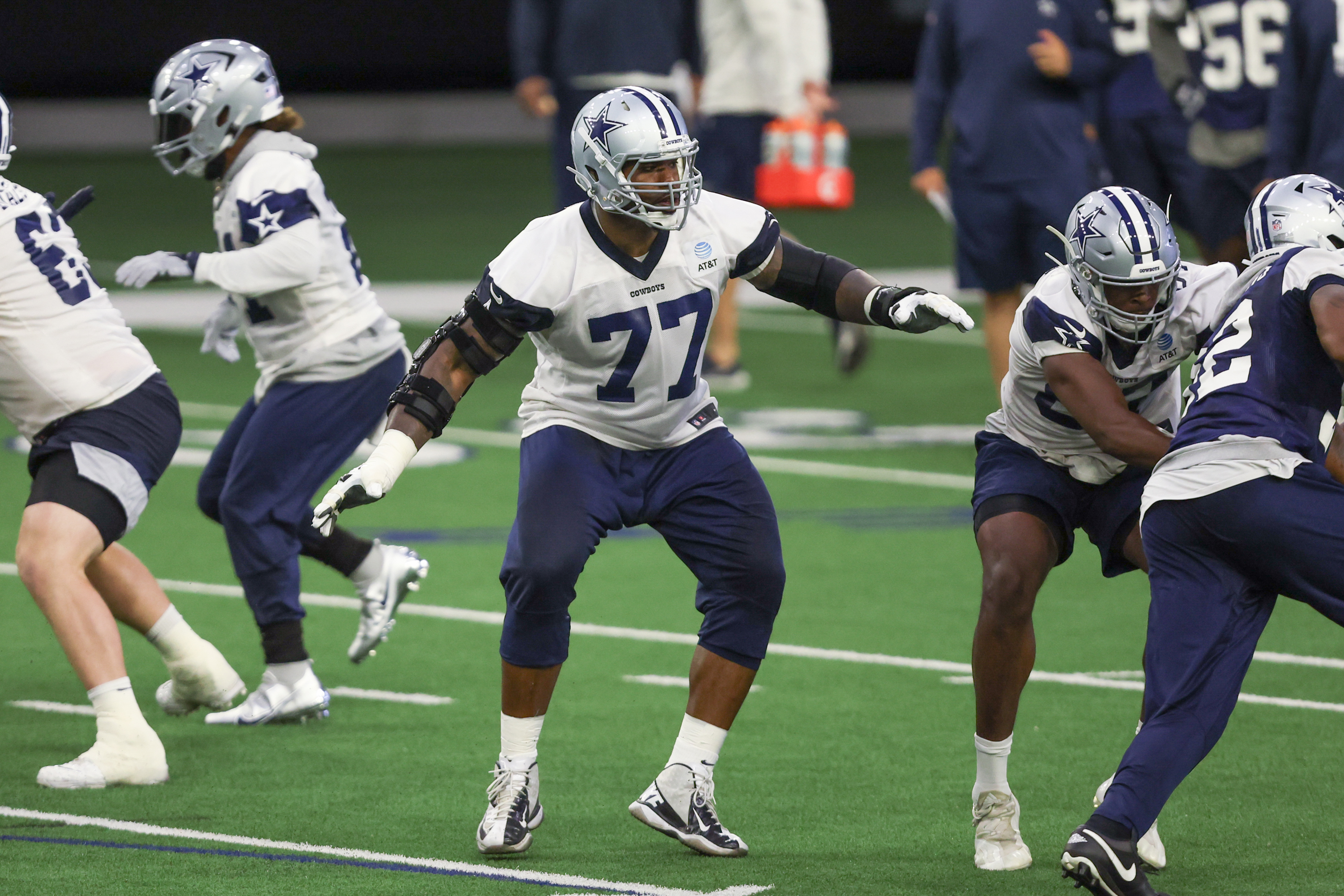 Dallas Cowboys tackle Tyron Smith (77) blocks during the Dallas Cowboys OTA Offseason Workouts on June 2, 2022 at The Star in Frisco, TX.