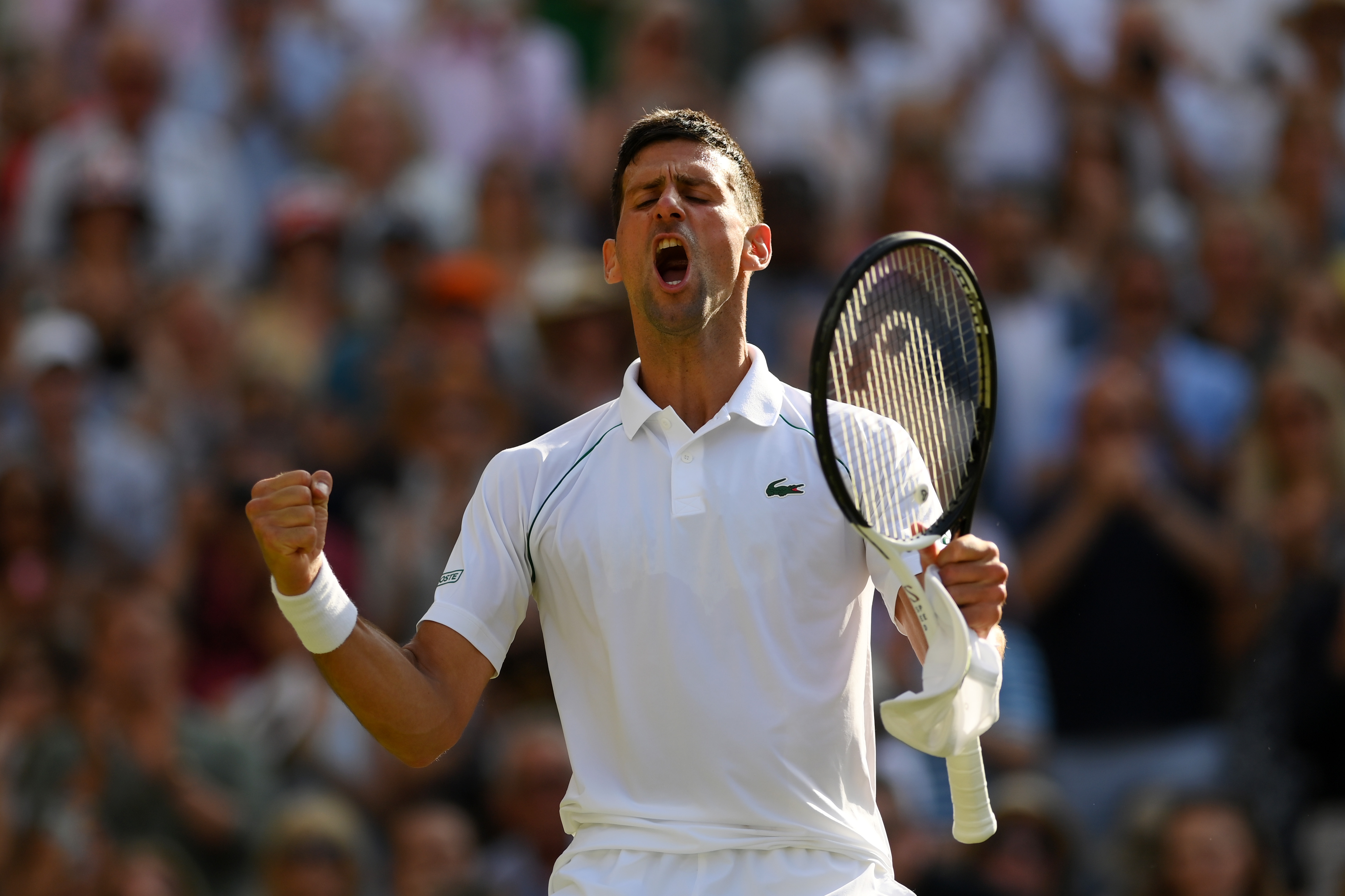 Novak Djokovic of Serbia celebrates match point against Cameron Norrie of Great Britain during the Mens’ Singles Semi Final match on day twelve of The Championships Wimbledon 2022 at All England Lawn Tennis and Croquet Club on July 08, 2022 in London, England.