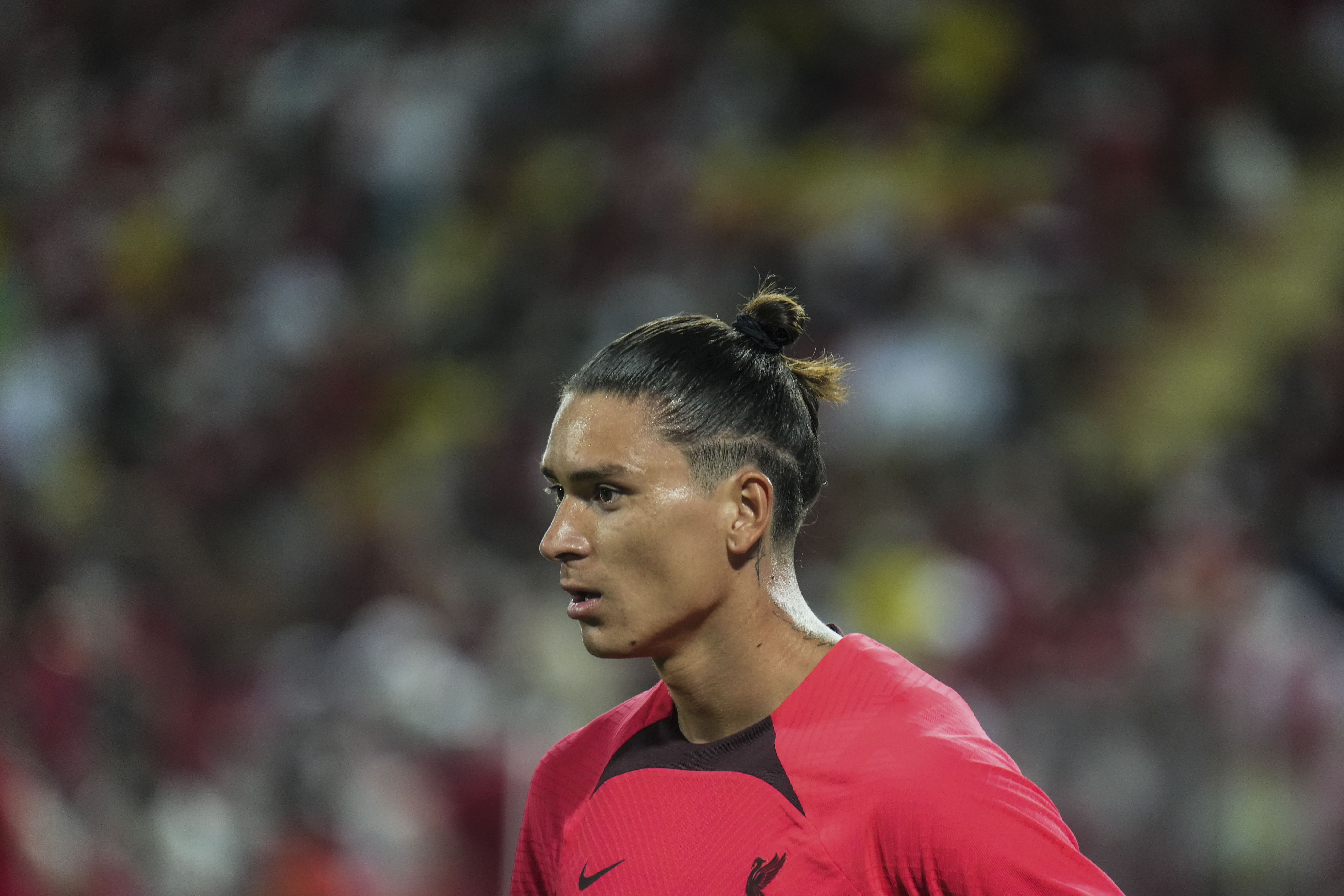 Liverpool’s newly signed player, forward Darwin Núñez warm up with their teammates during their training session at Rajamangala National Stadium in Bangkok, Thailand, 11 July 2022.