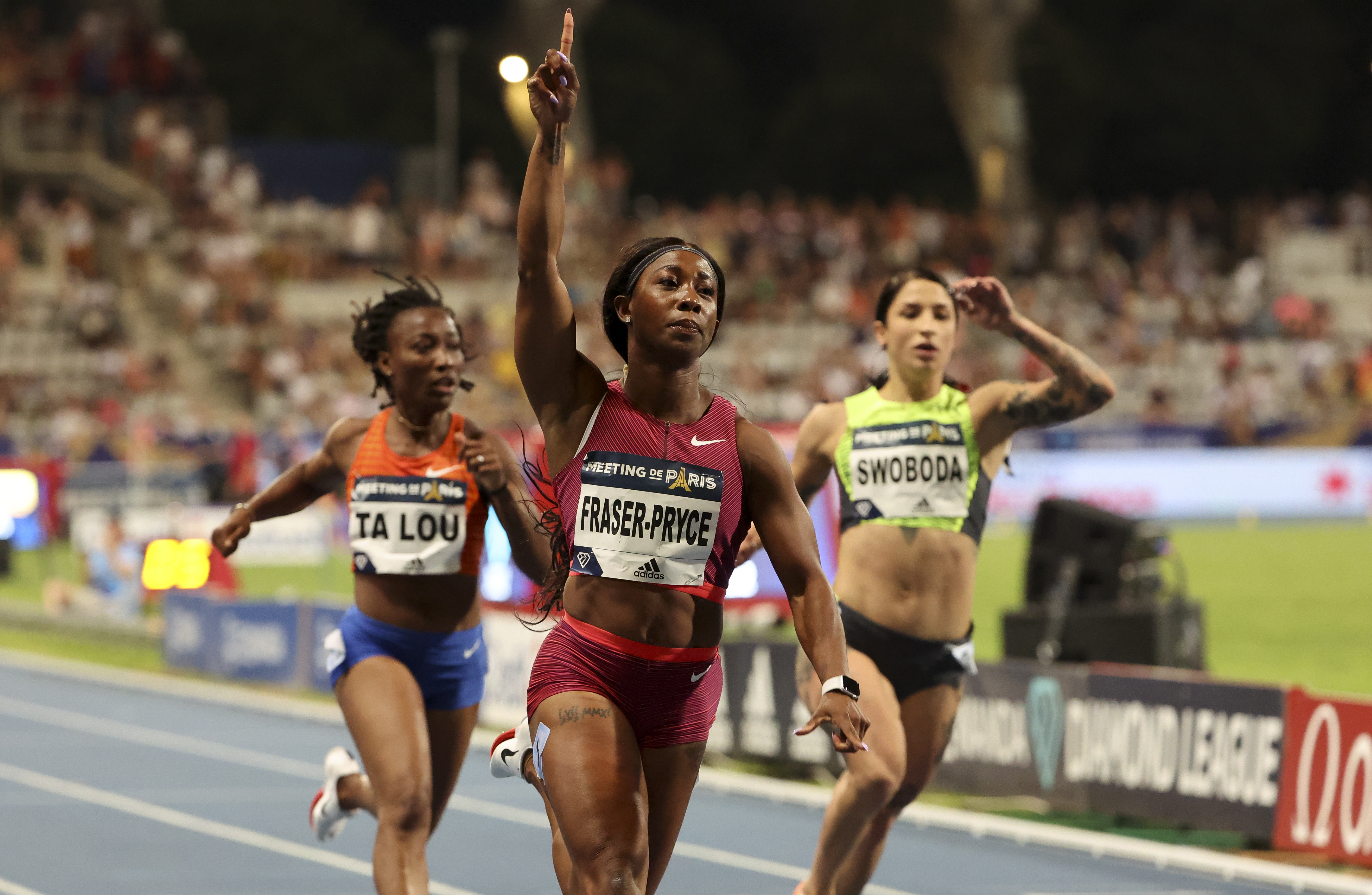 Shelly-Ann Fraser-Pryce of Jamaica celebrates winning the 100m. left Marie-Josee Ta Lou of Ivory Coast, Ewa Swoboda of Poland during the Meeting de Paris 2022, part of the Wanda Diamond League series at Stade Charlety on June 18, 2022 in Paris, France.