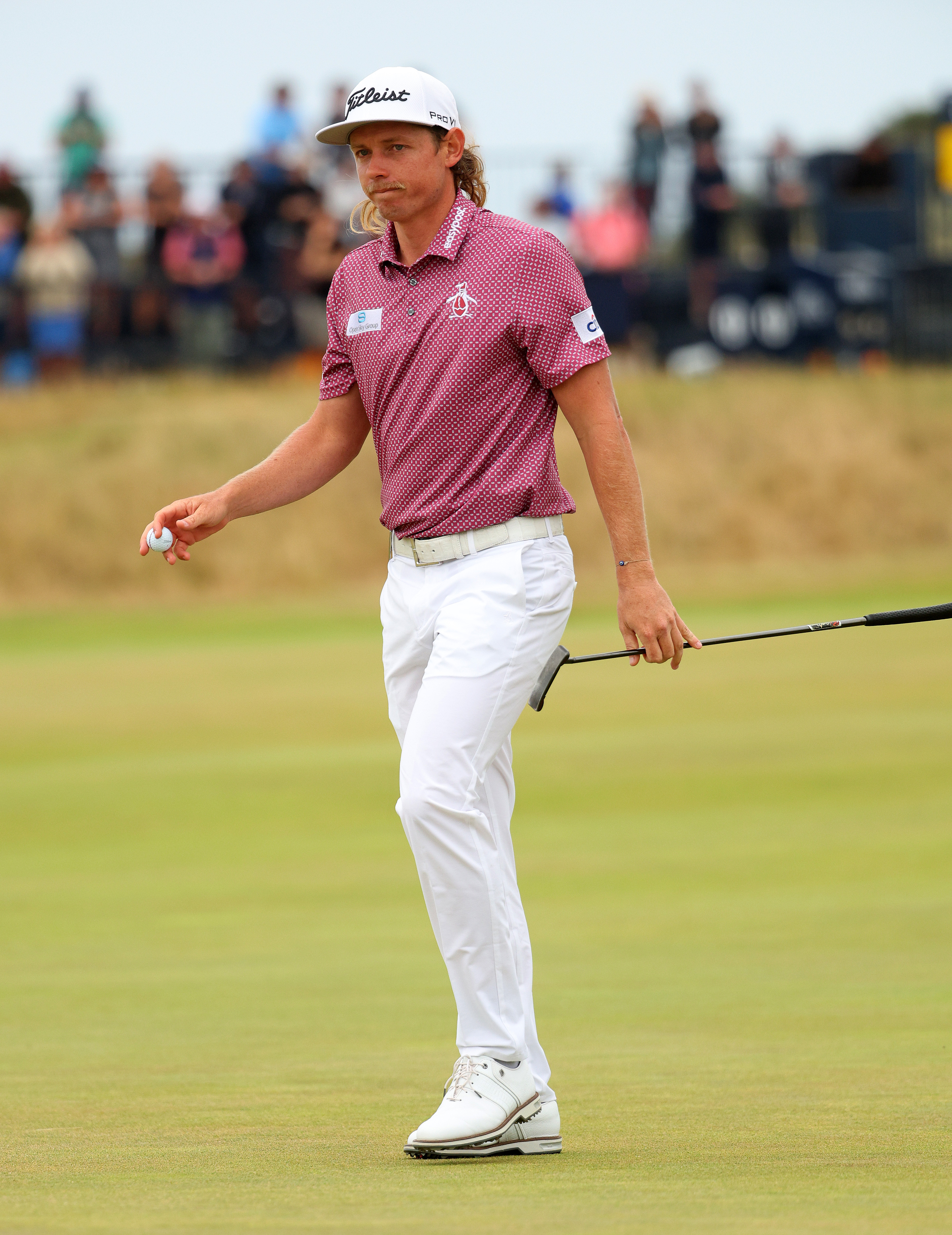 Cameron Smith of Australia acknowledges the crowd on the 13th green during Day Four of The 150th Open at St Andrews Old Course on July 17, 2022 in St Andrews, Scotland.