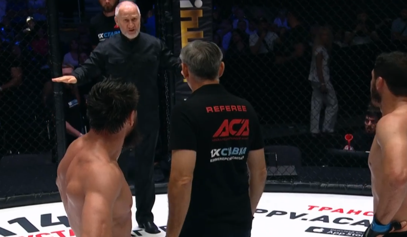 ACA president Mairbek Khasiev enters the cage after the fourth round of a fight between Rashid Magomedov and Ali Bagov.