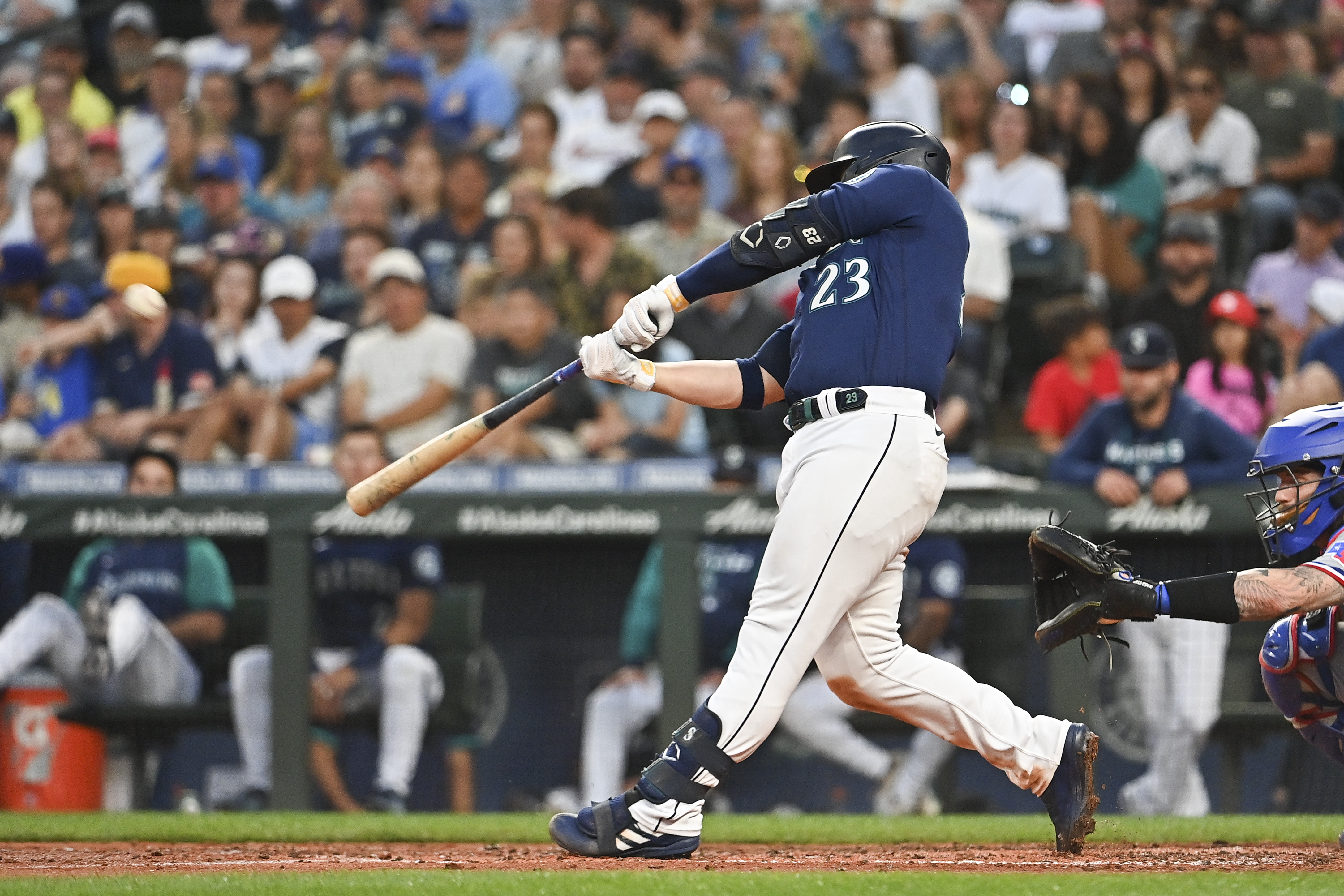 Ty France #23 of the Seattle Mariners hits a solo home run during the fifth inning against the Texas Rangers at T-Mobile Park on July 25, 2022 in Seattle, Washington.
