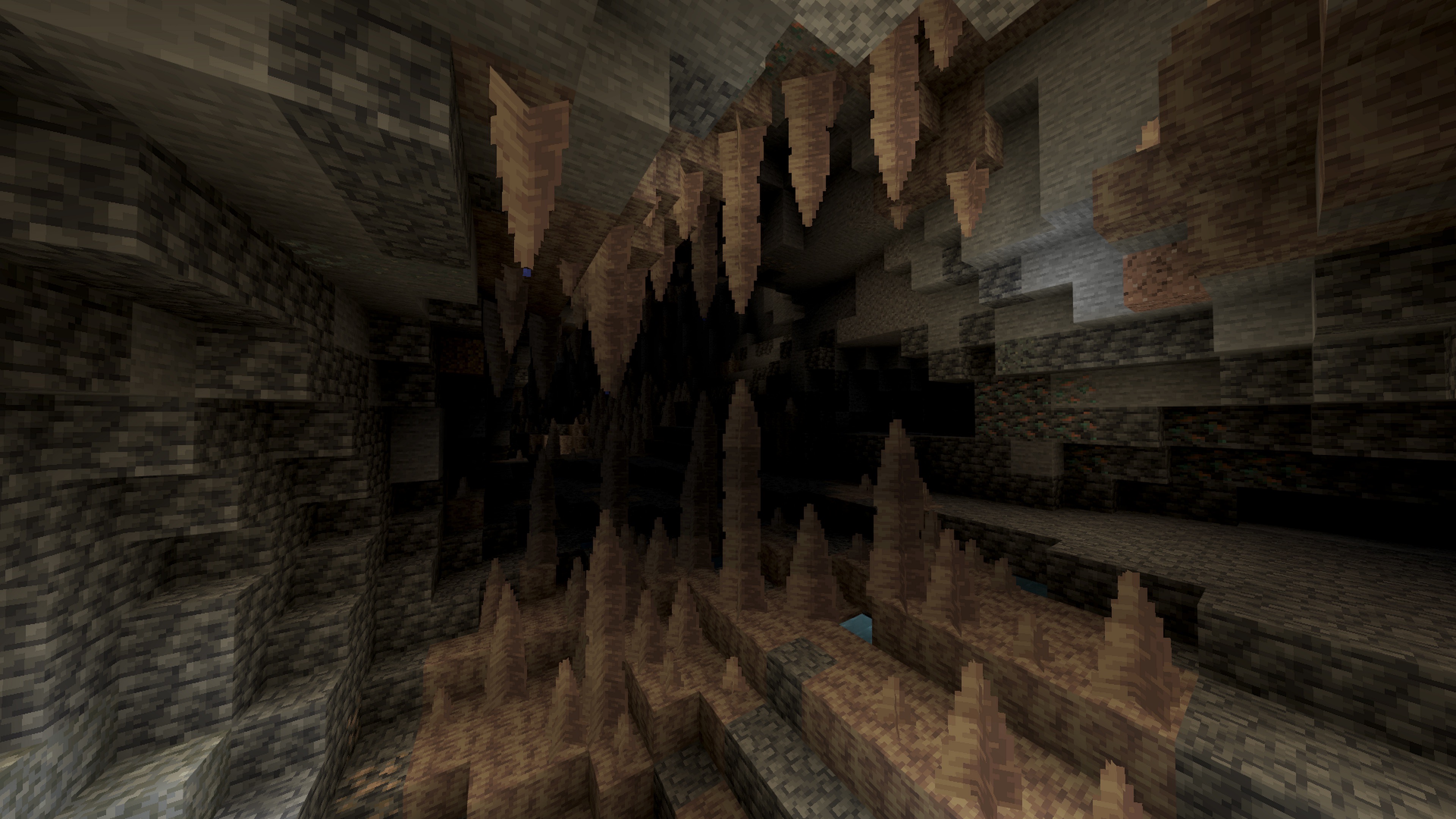 A Minecraft dripstone cave with stalactites and stalagmites.