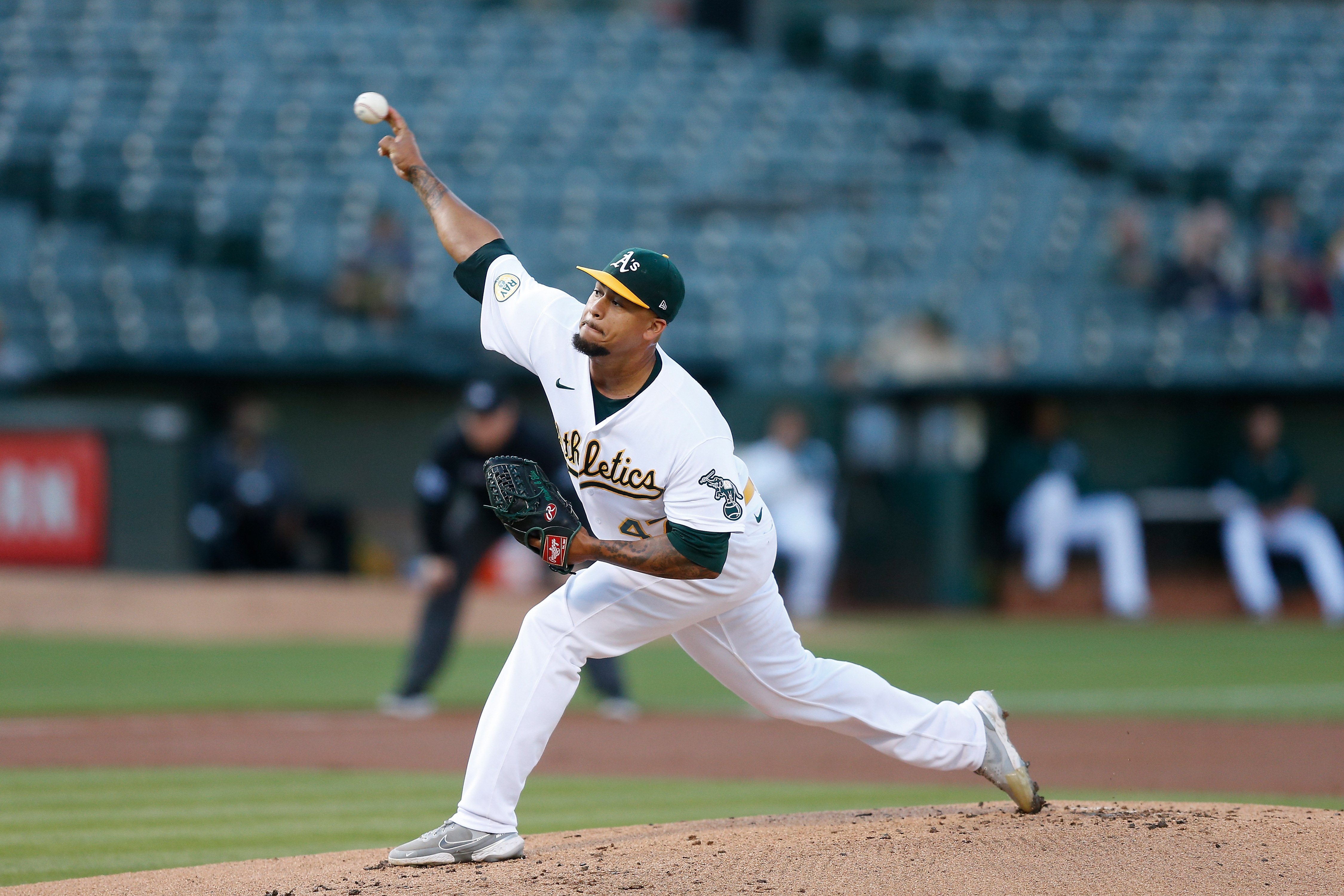 Frankie Montas #47 of the Oakland Athletics pitches in the top of the first inning against the Houston Astros at RingCentral Coliseum on July 26, 2022 in Oakland, California.