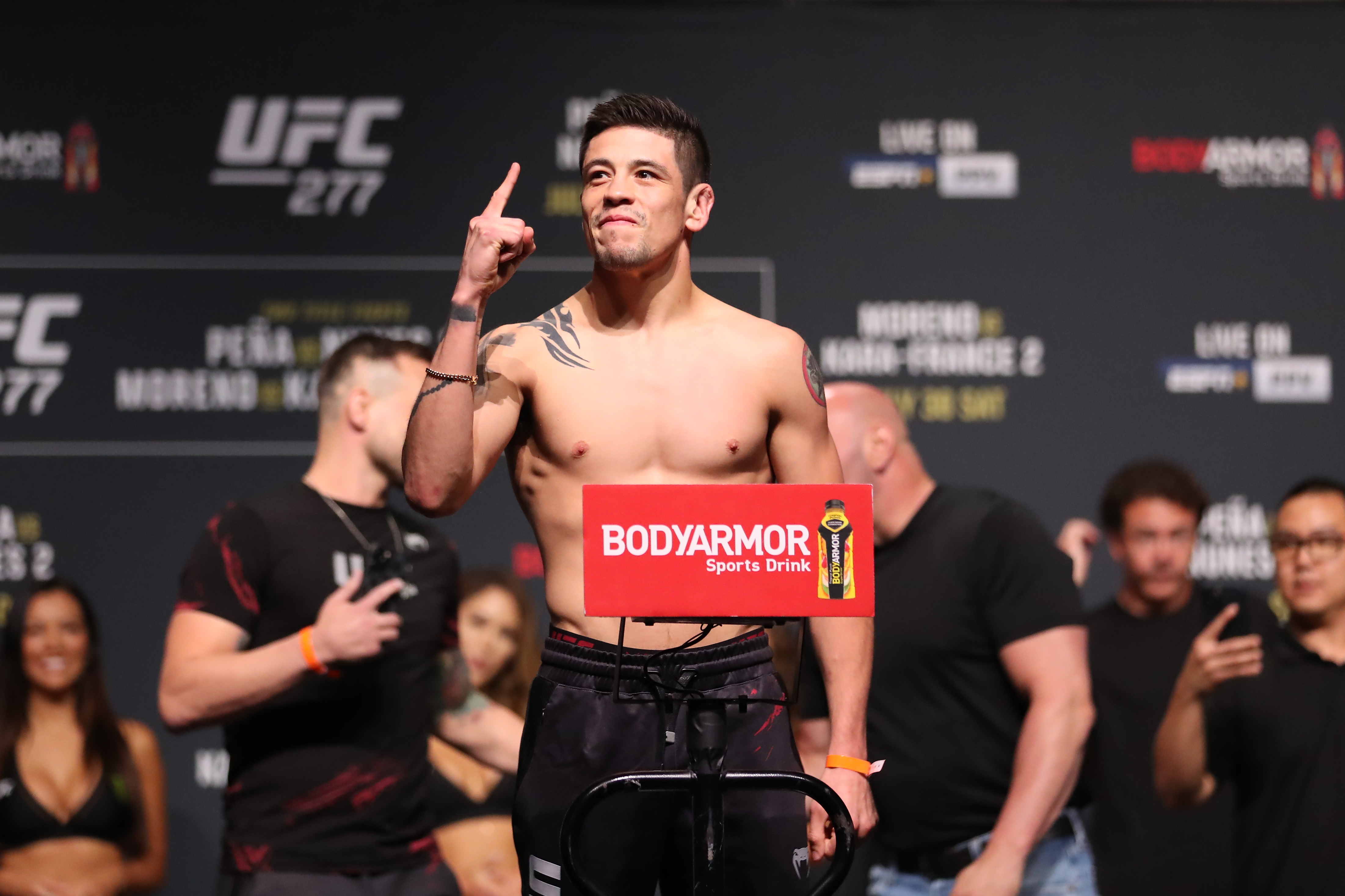 Brandon Moreno steps on the scale for the ceremonial weigh-in for the UFC 277 ceremonial weigh-ins on July 29, 2022, at the American Airlines Center in Dallas, TX.