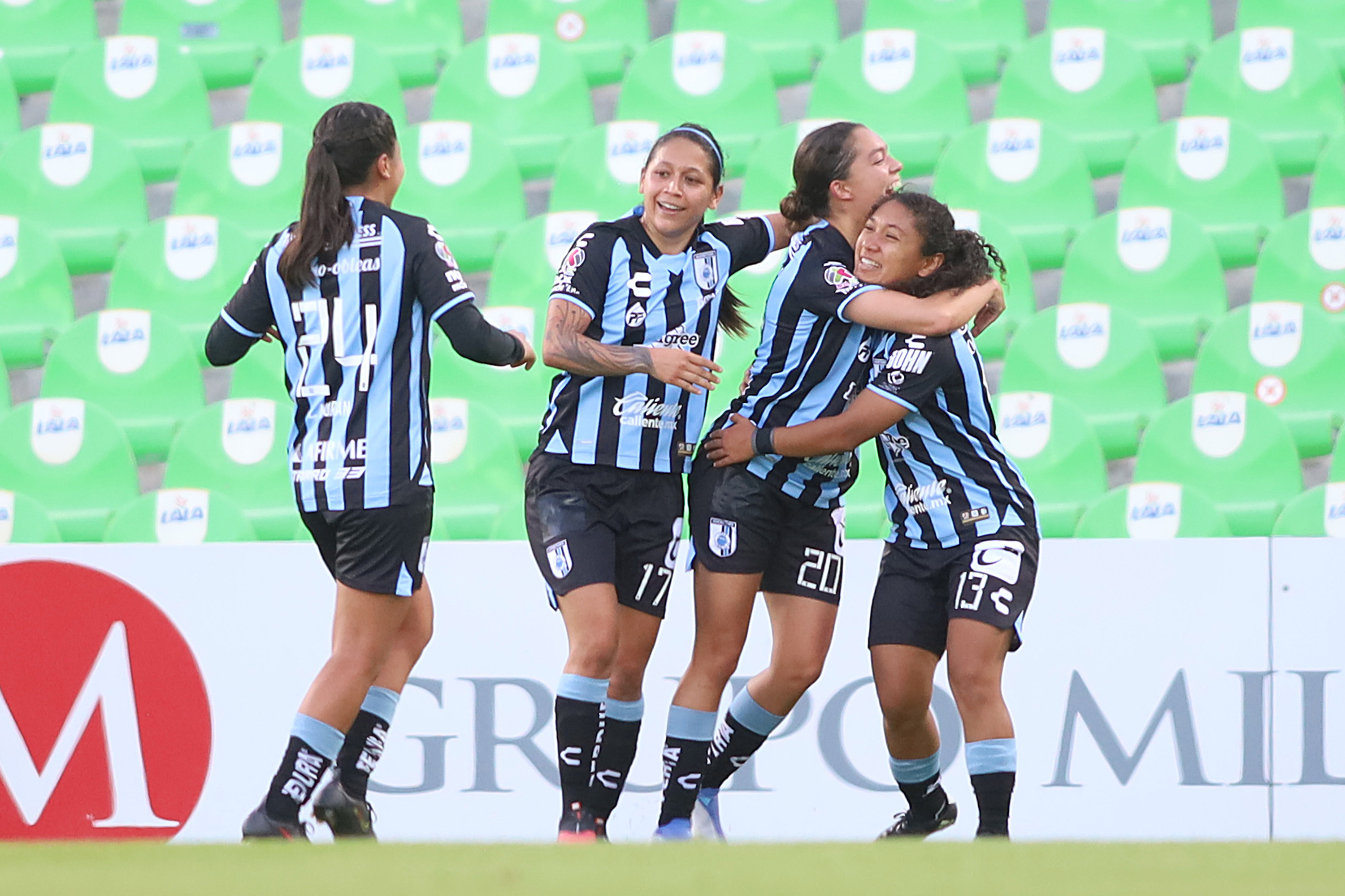 Alejandra Figueroa of Queretaro celebrates with teammates after scoring the second goal of her team during the 1st round match between Santos Laguna and Queretaro as part of the Torneo Apertura 2022 Liga MX Femeni at Corona Stadium on July 10, 2022 in Torreon, Mexico.