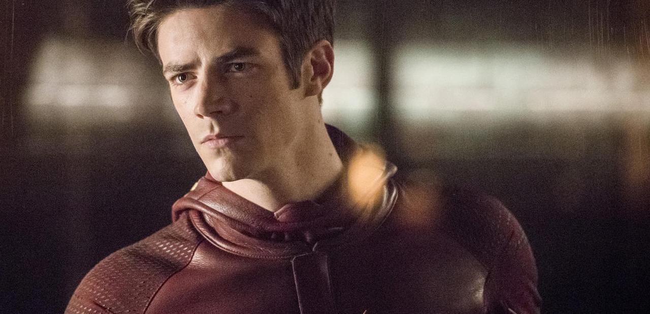 Barry Allen, his Flash mask around his shoulder, looks intensely into the middle distance.