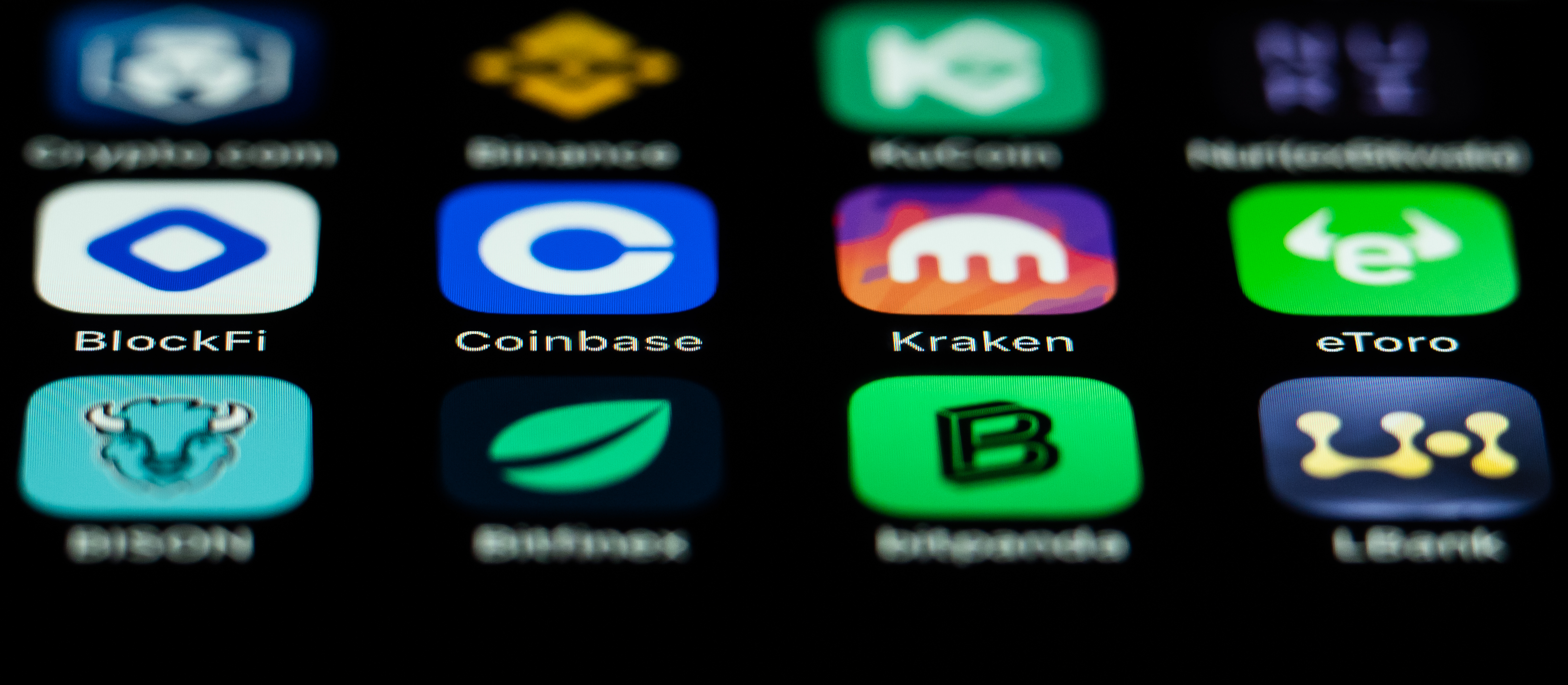 A phone screen showing app icons for cryptocurrency companies.