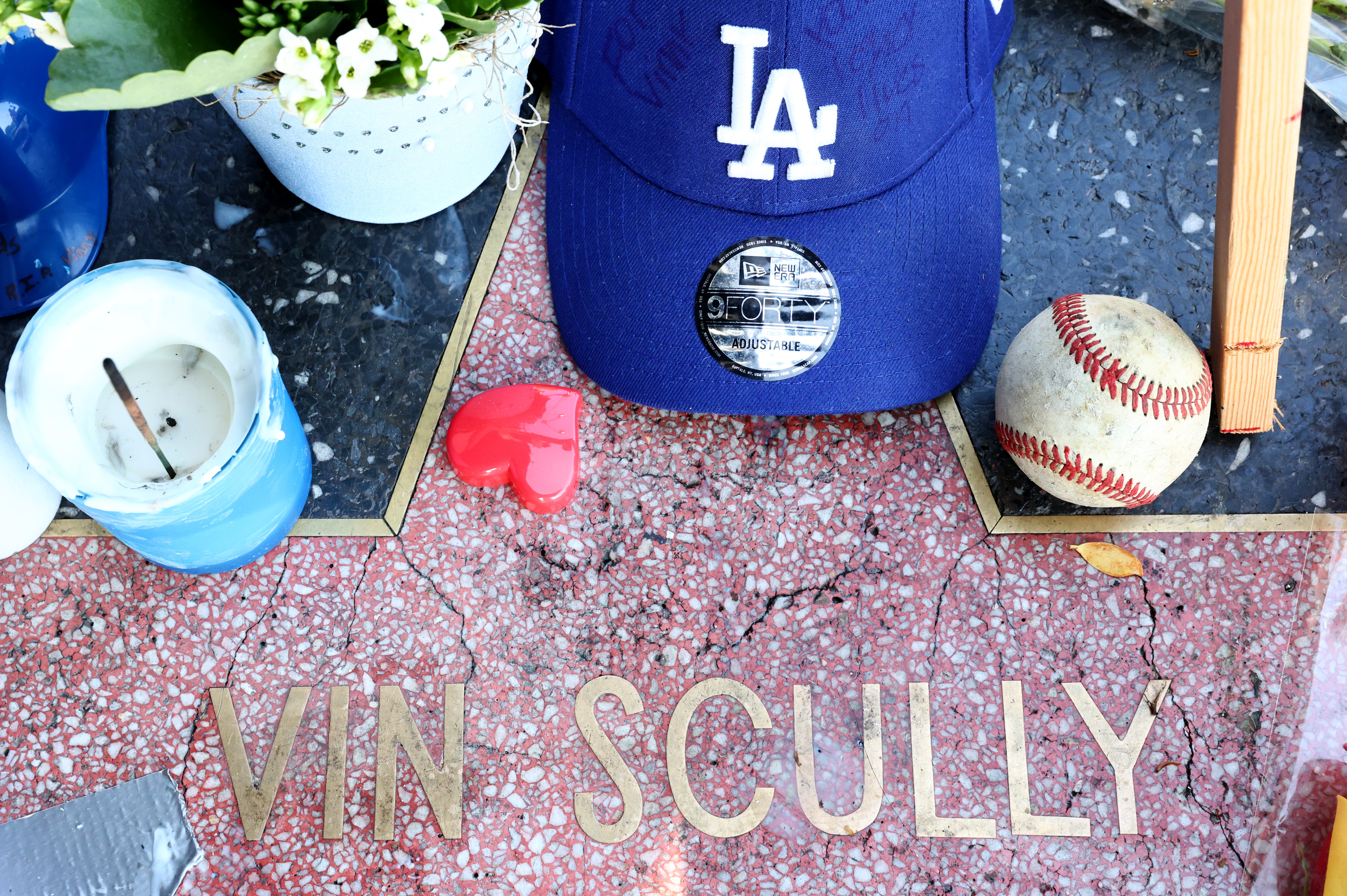People Pay Tribute To Iconic Los Angeles Dodgers Announcer Vin Scully At His Star On The Hollywood Walk Of Fame
