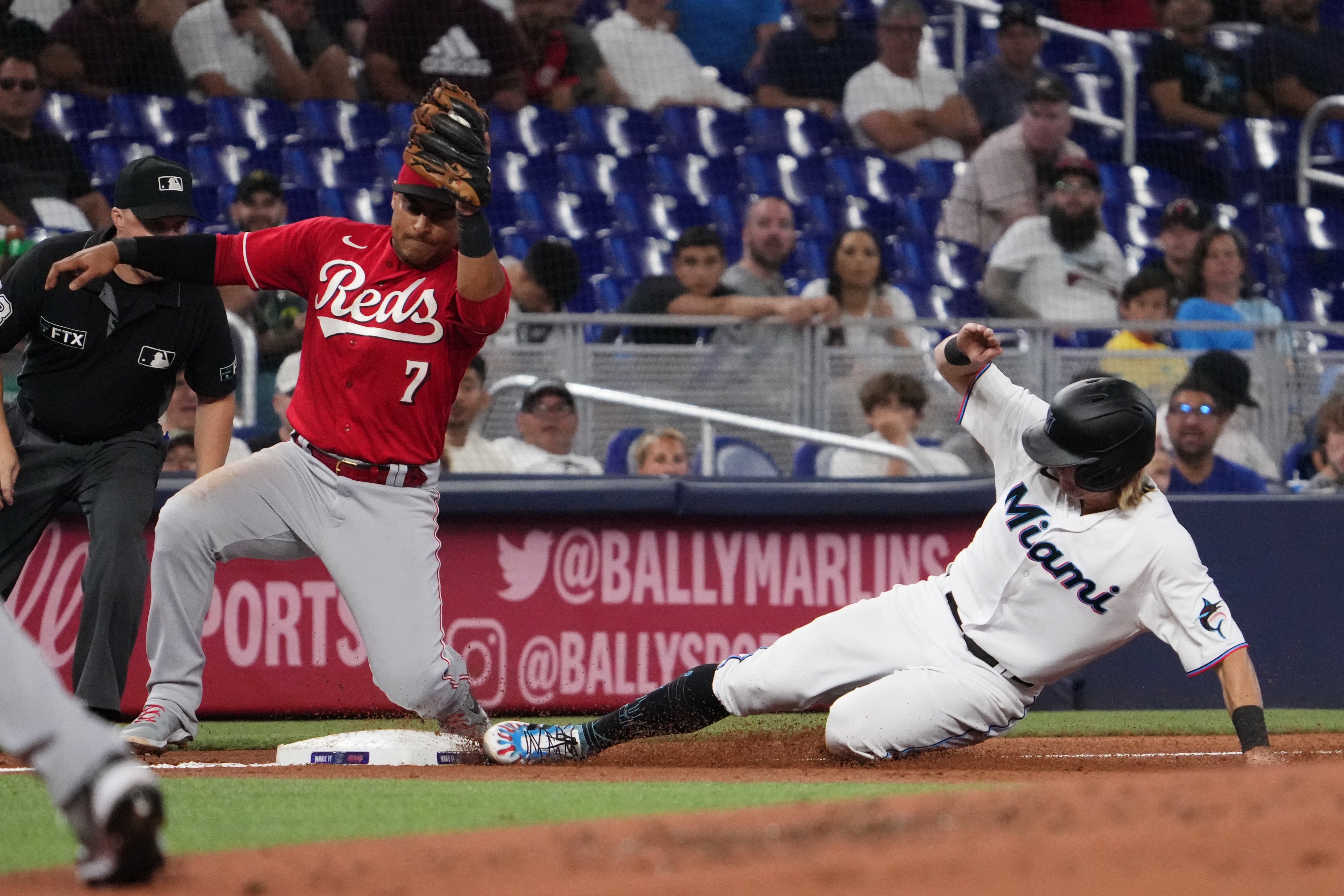 MLB: Cincinnati Reds at Miami Marlins second baseman Luke Williams (46) steals third base ahead of the tag of Cincinnati Reds third baseman Donovan Solano (7) in the third inning at loanDepot Park.&nbsp;Miami Marlins