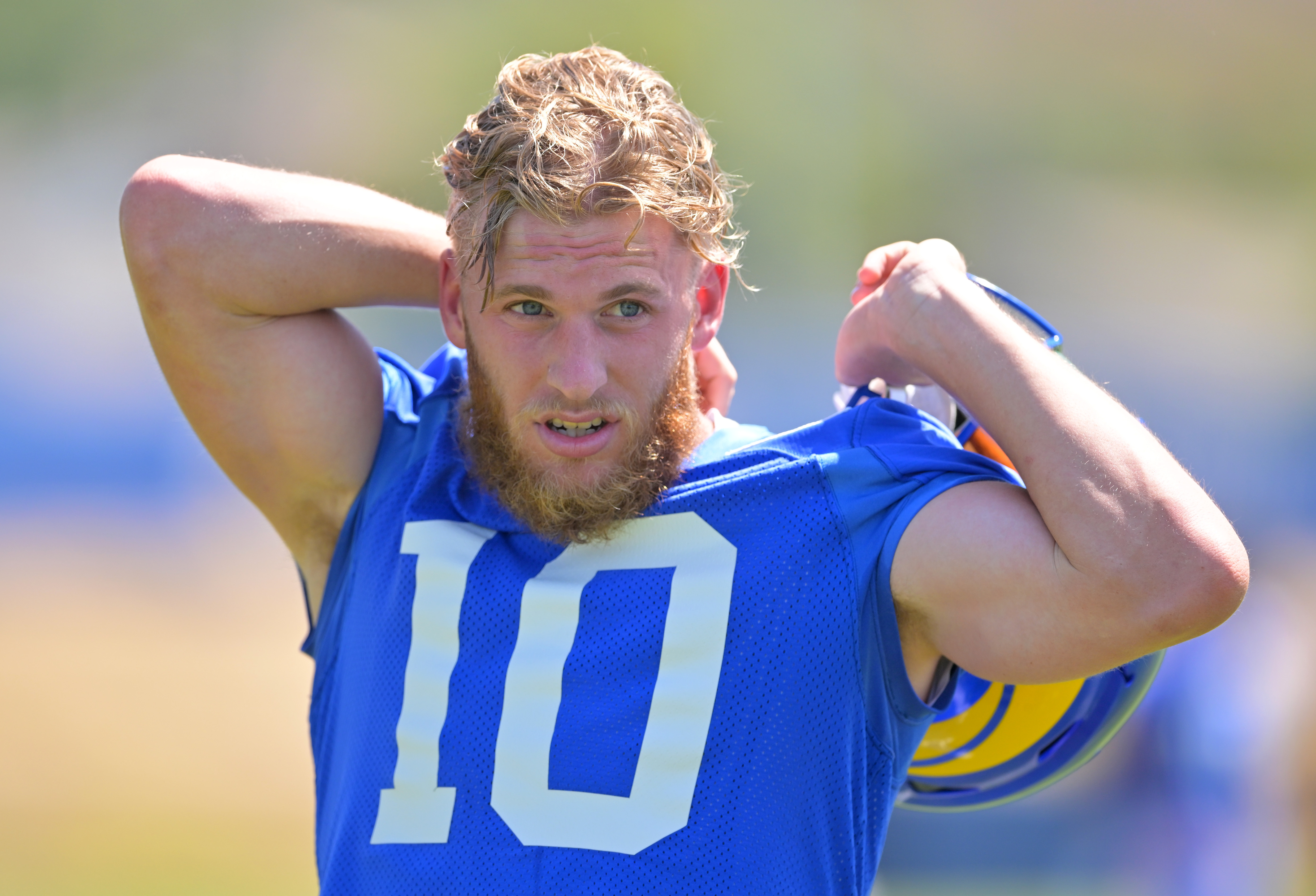 Cooper Kupp #10 of the Los Angeles Rams takes off his jersey following the first day mini camp on June 7, 2022 at the team’s facility at California Lutheran University in Thousand Oaks, California.