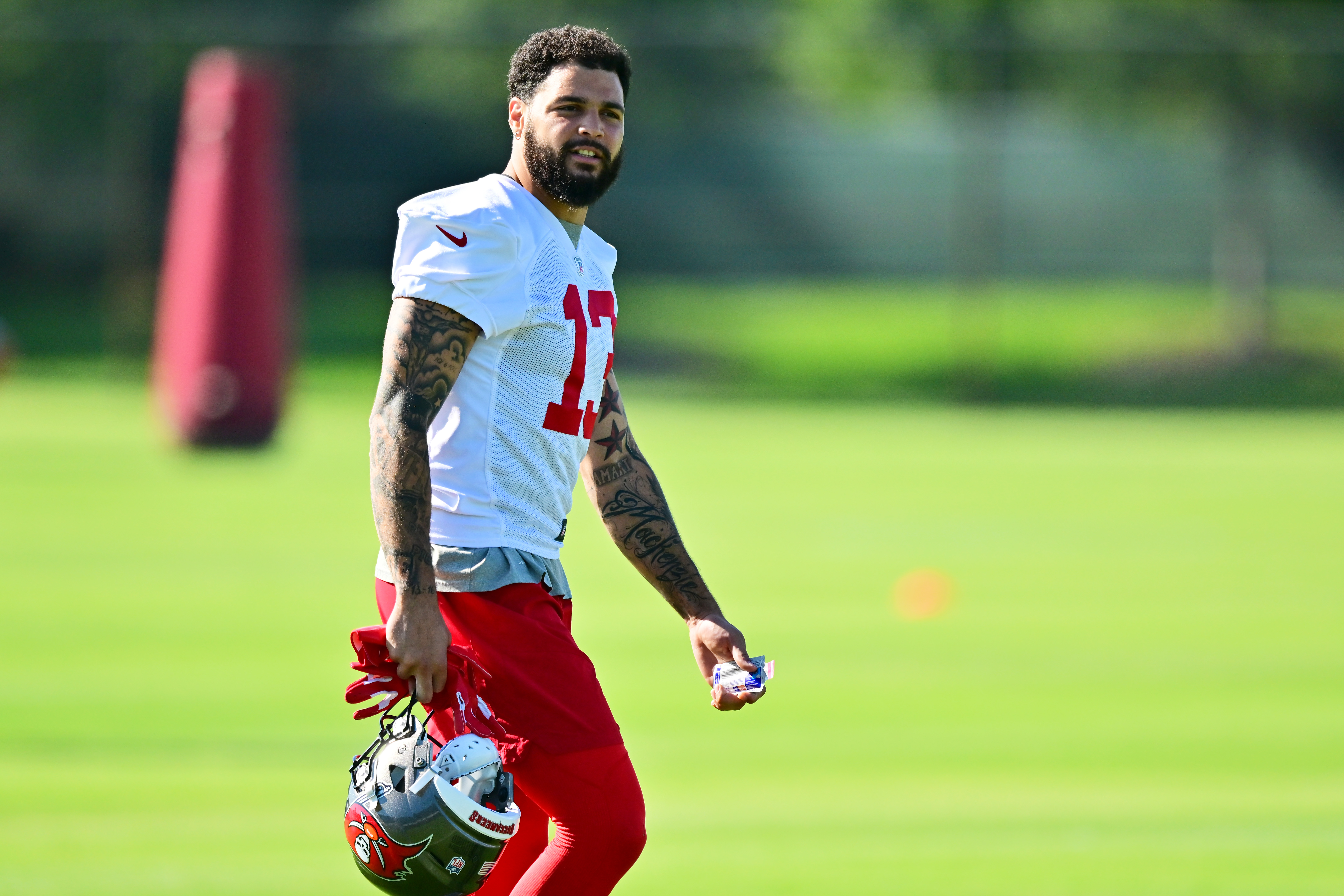 Mike Evans #13 of Tampa Bay Buccaneers looks on during the 2022 Buccaneers minicamp at AdventHealth Training Center on June 08, 2022 in Tampa, Florida.