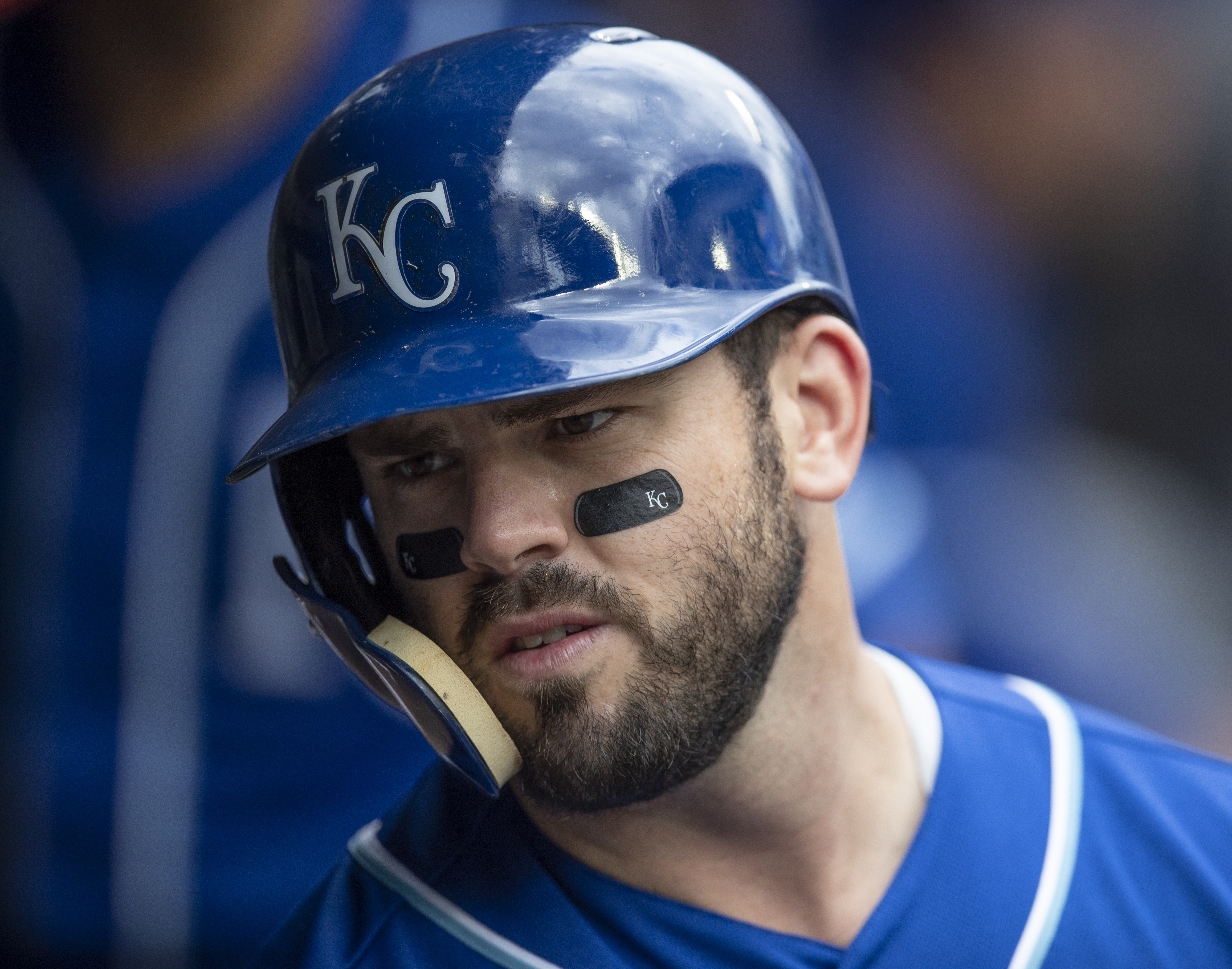 Mike Moustakas #8 of the Kansas City Royals is pictured in the dugout before a game against the Seattle Mariners at Safeco Field on July 1, 2018 in Seattle, Washington. The Mariners won the game 1-0.