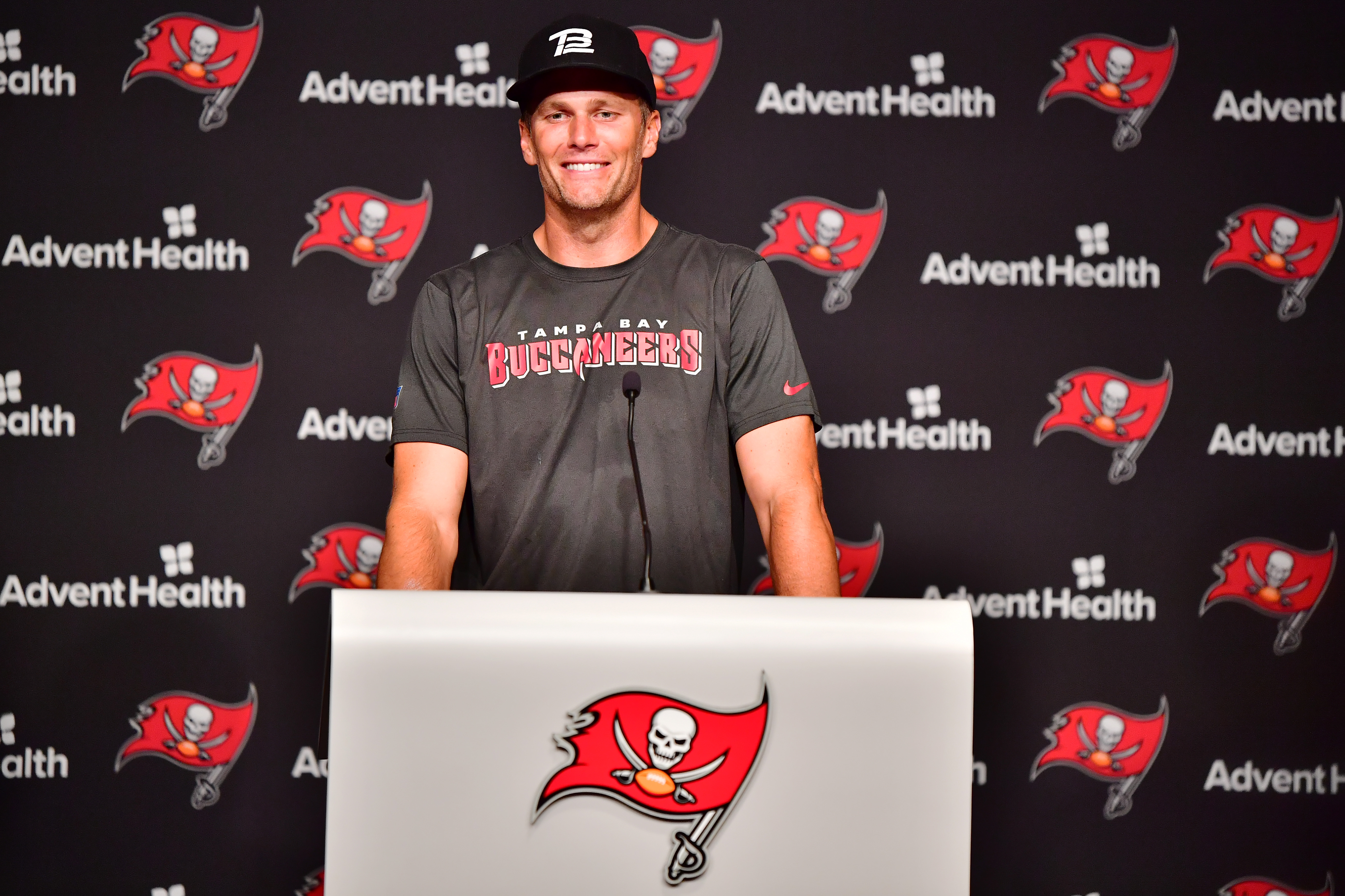 Tom Brady #12 of Tampa Bay Buccaneers answers questions at a press conference following the 2022 Buccaneers minicamp at AdventHealth Training Center on June 09, 2022 in Tampa, Florida.
