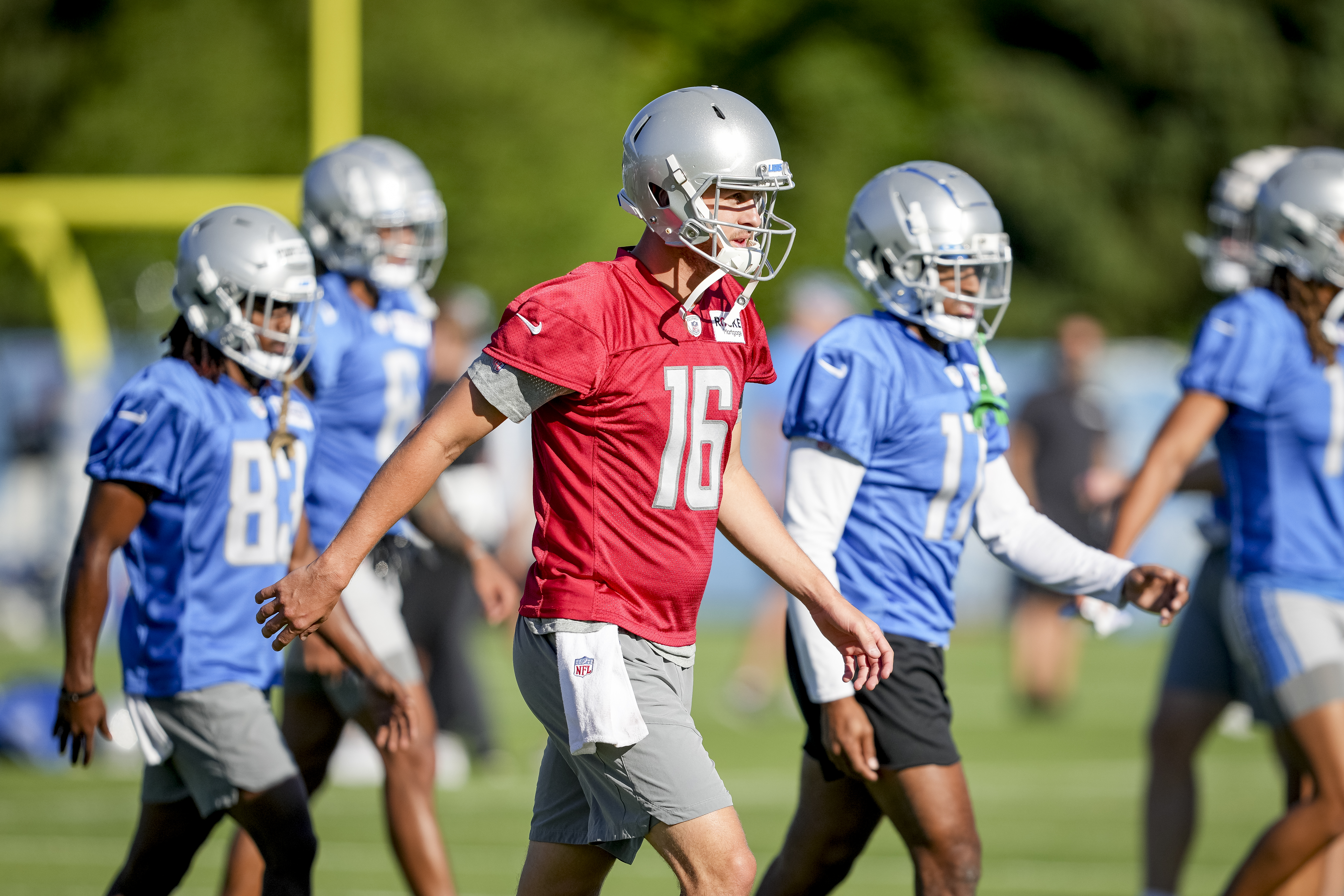 Jared Goff #16 of the Detroit Lions warms up during the Detroit Lions Training Camp at the Lions Headquarters and Training Facility on July 29, 2022 in Allen Park, Michigan.