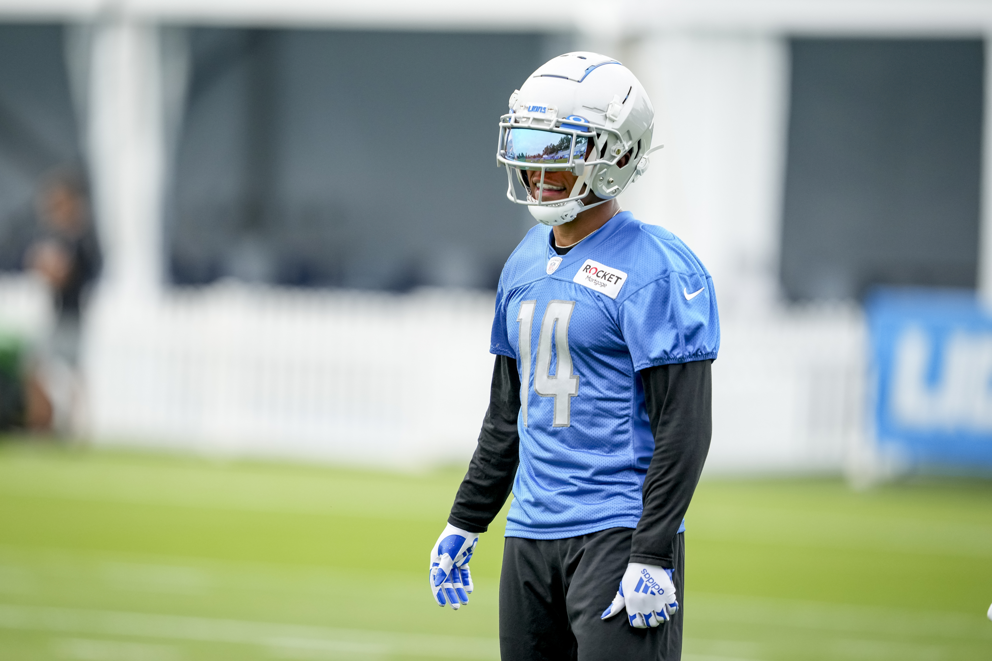 Amon-Ra St. Brown #14 looks on during the Detroit Lions Training Camp on July 27, 2022 in Allen Park, Michigan.