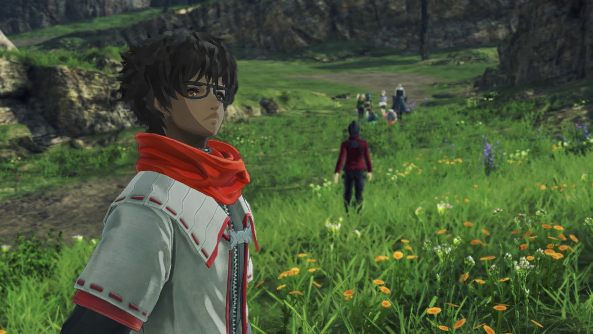 Xenoblade Chronicle 3’s Taion standing in a field with the party walking away behind him.