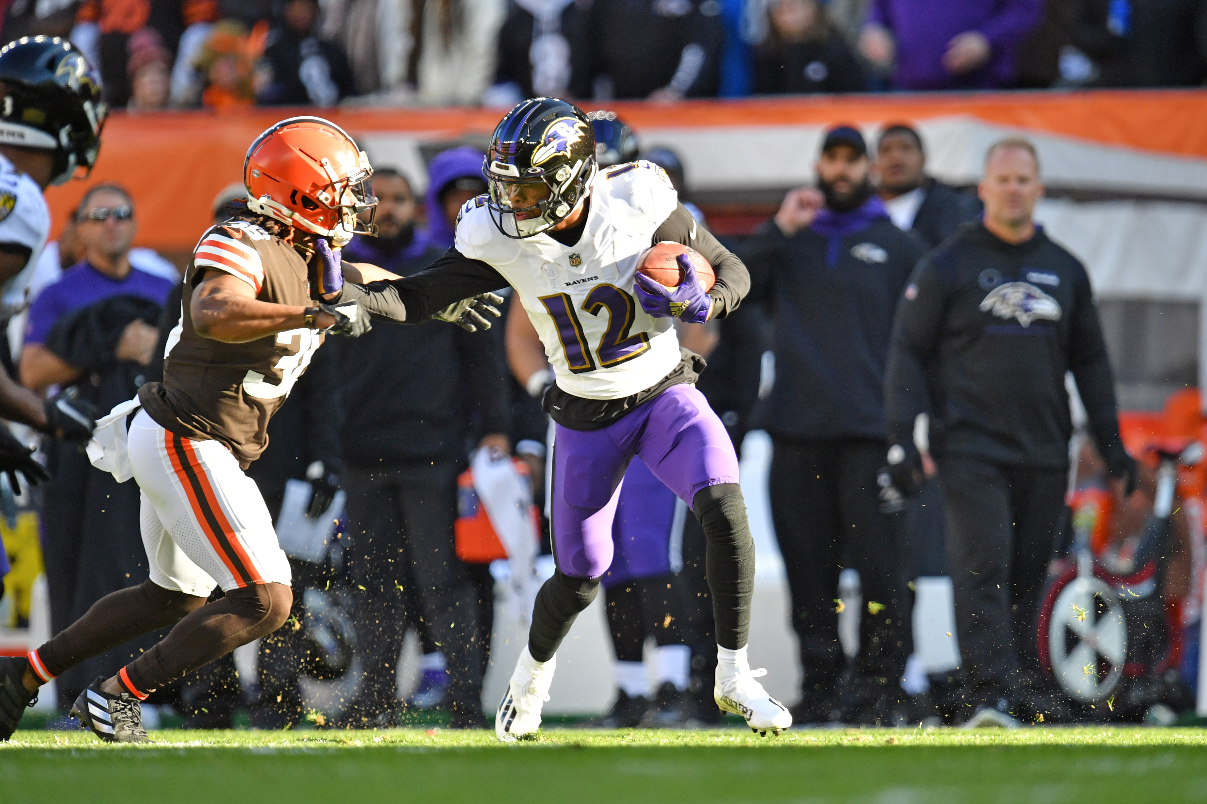 Cornerback M.J. Stewart #36 of the Cleveland Browns tries to tackle wide receiver Rashod Bateman #12 of the Baltimore Ravens during the first half at FirstEnergy Stadium on December 12, 2021 in Cleveland, Ohio.