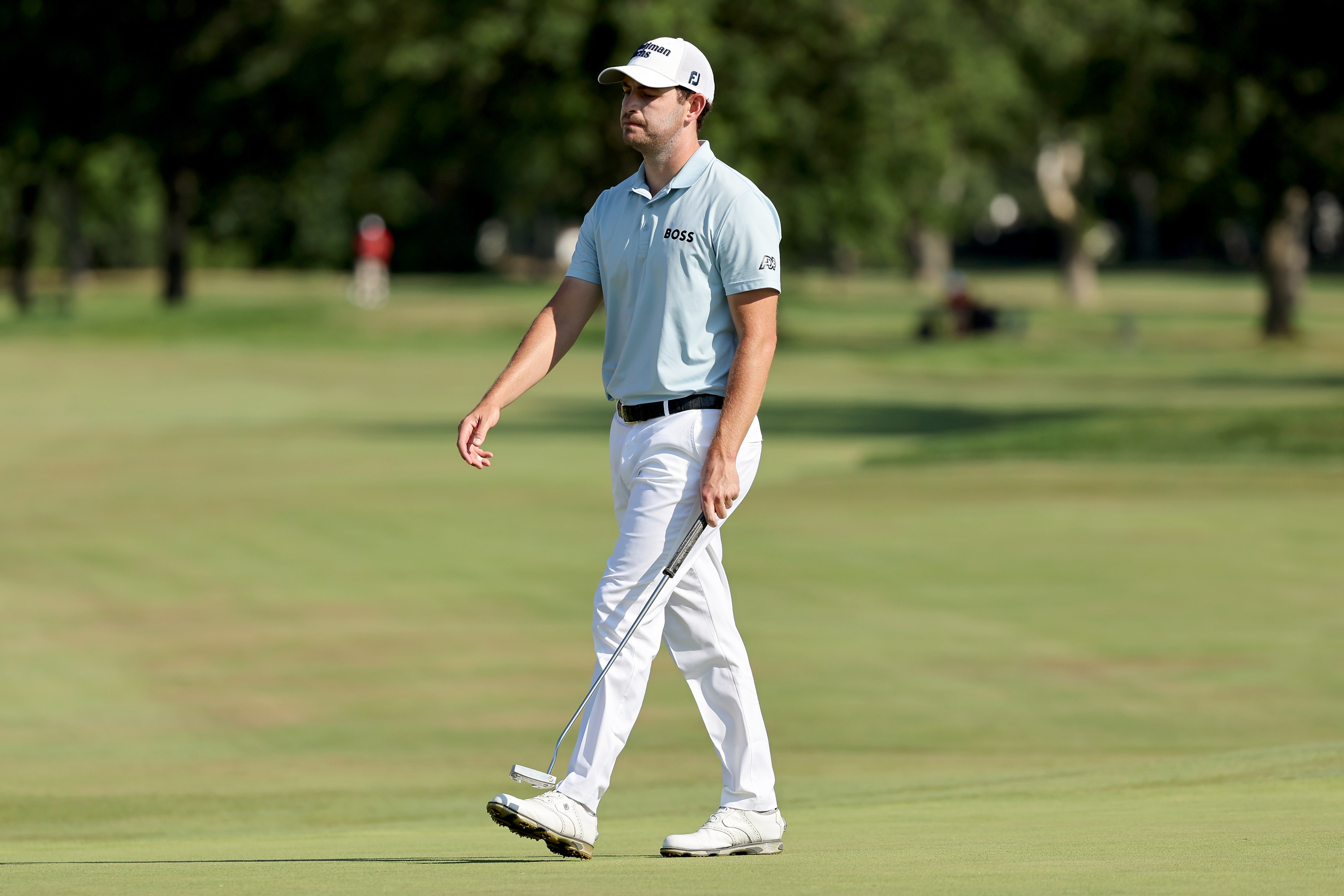 Patrick Cantlay of the United States reacts after missing a putt on the 17th green during the final round of the Rocket Mortgage Classic at Detroit Golf Club on July 31, 2022 in Detroit, Michigan.