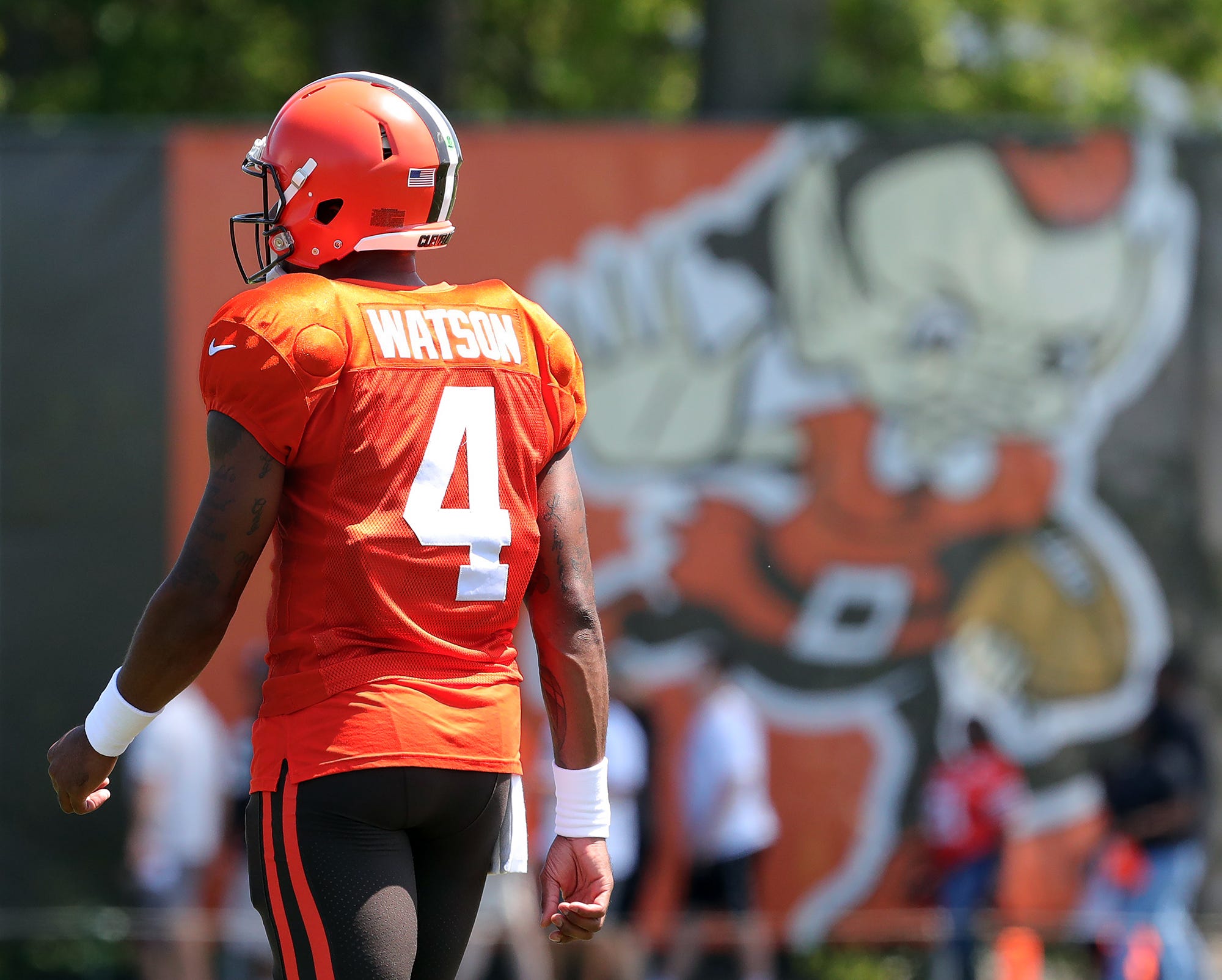 Cleveland Browns quarterback Deshaun Watson walks off the field in between drills during the NFL football team’s football training camp in Berea on Tuesday.&nbsp;
