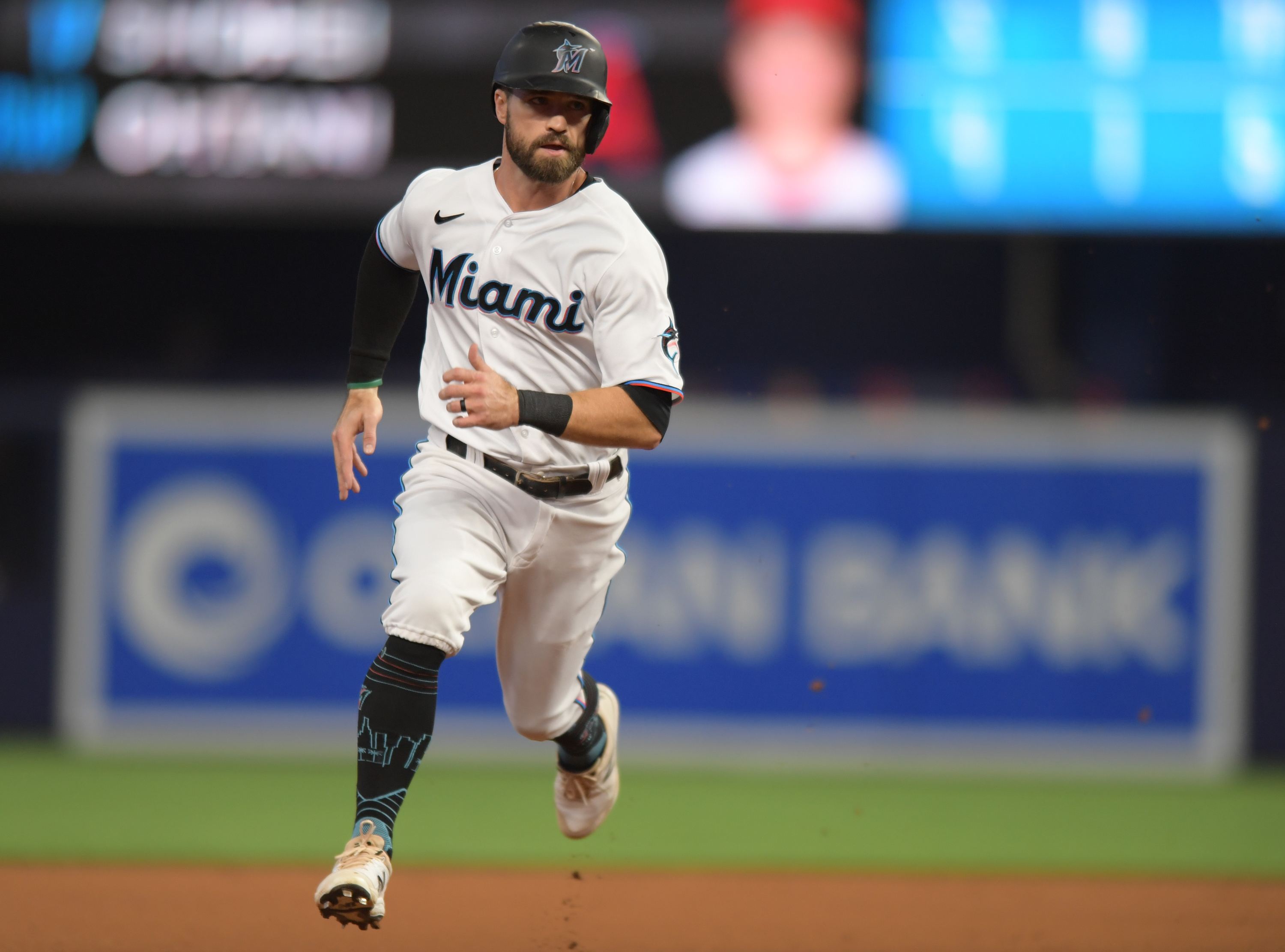 Miami Marlins third baseman Jon Berti (5) heads for third base in the first inning against the Los Angeles Angels at loanDepot Park.