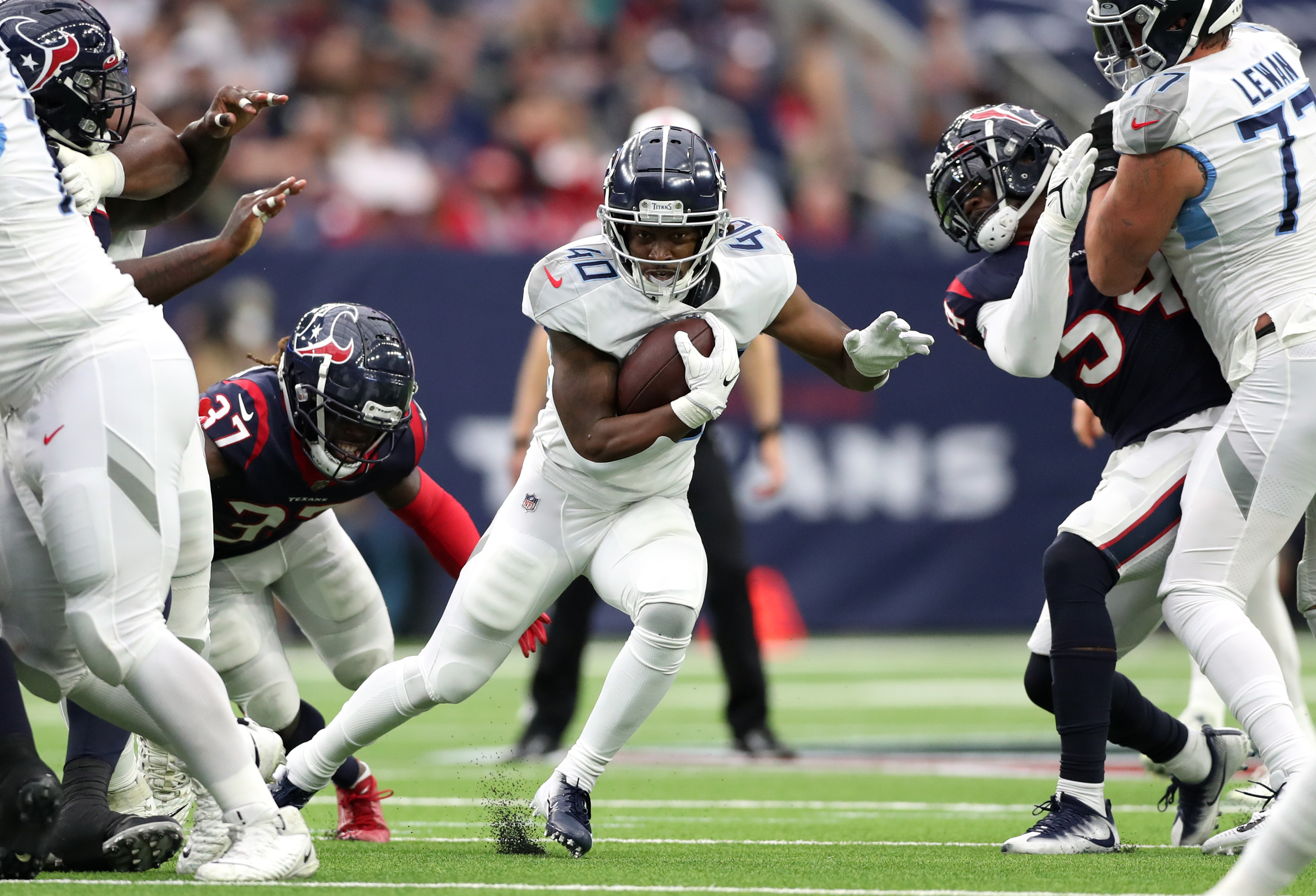 Dontrell Hilliard #40 of the Tennessee Titans runs the ball during the second quarter against the Houston Texans at NRG Stadium on January 09, 2022 in Houston, Texas.