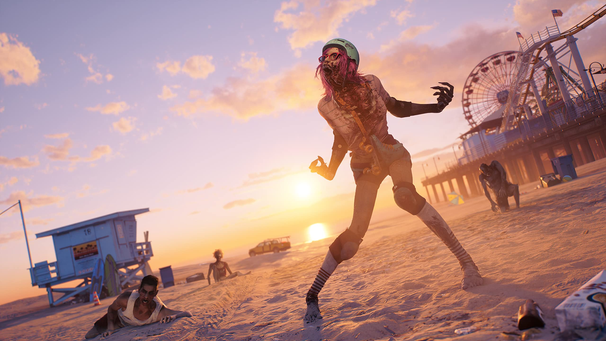 A zombie wearing a helmet and roller skates stands on a beach at the Santa Monica pier in a still from Dead Island 2