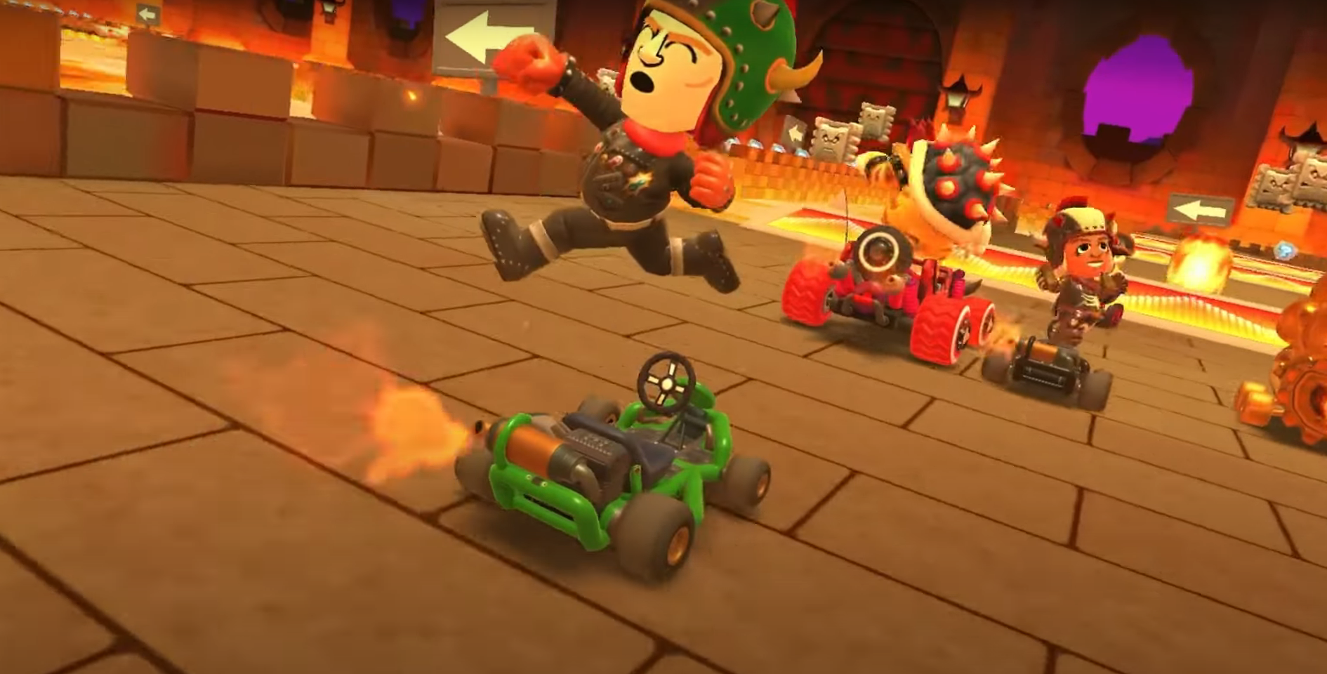 A Mii using the Mario Kart Tour Bowser Tour suit during a race in GBA Bowser Castle 3 