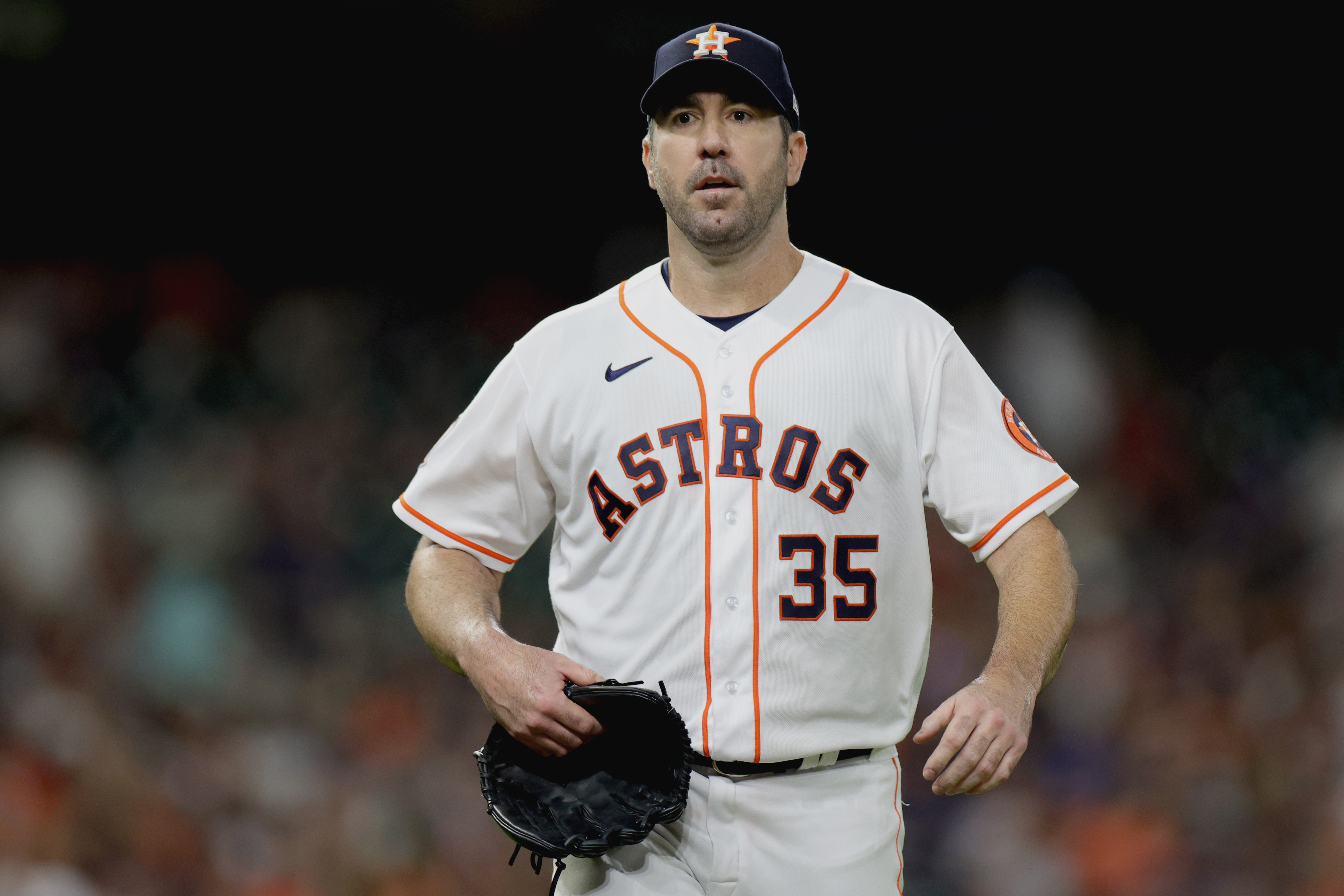Justin Verlander #35 of the Houston Astros walks back the dugout after getting out of the fourth inning against the Minnesota Twins at Minute Maid Park on August 23, 2022 in Houston, Texas.