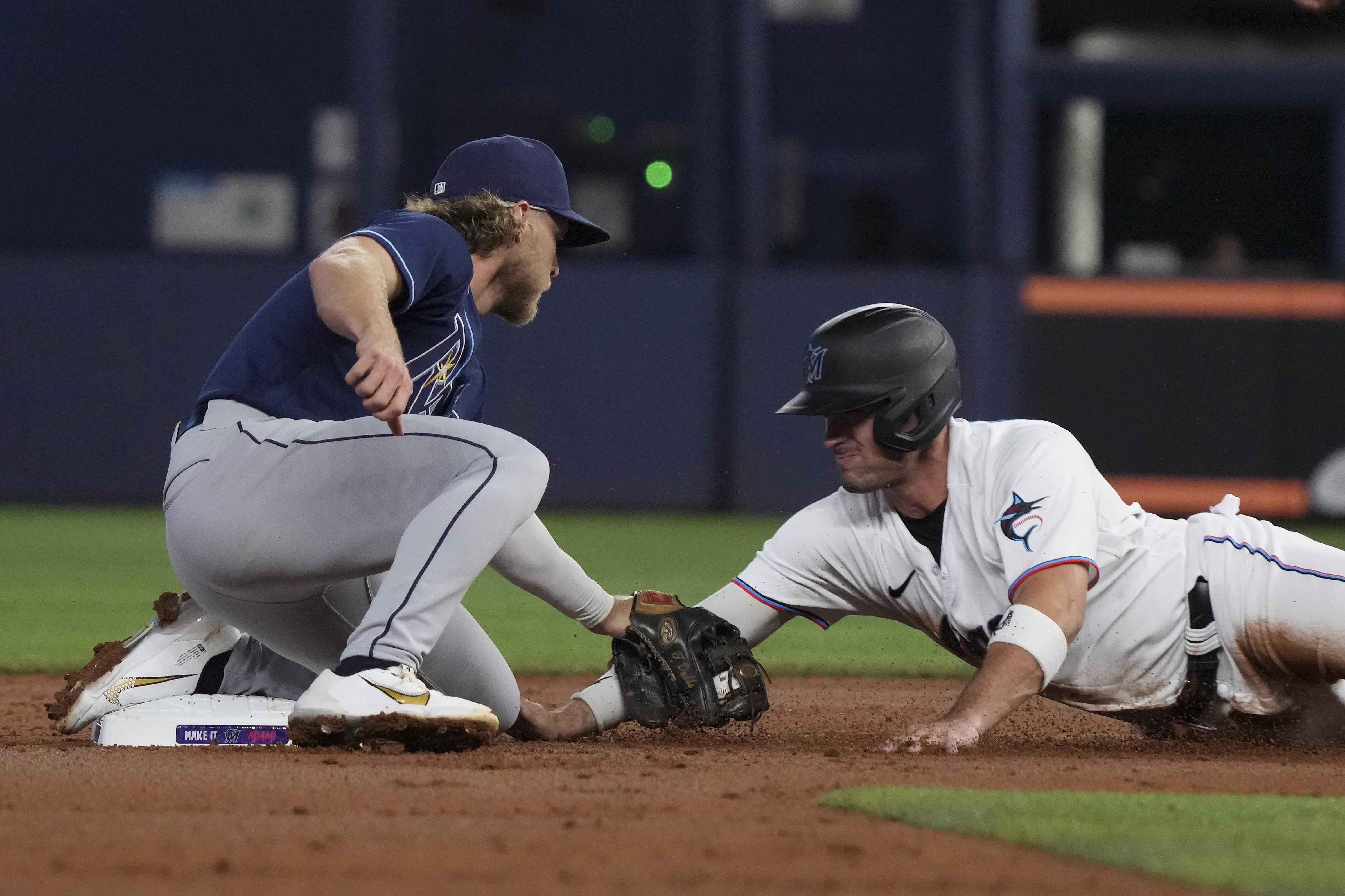 Nick Fortes #54 of the Miami Marlins is caught stealing second base by Taylor Walls #0 of the Tampa Bay Rays in the second inning at loanDepot park on August 30, 2022 in Miami, Florida.