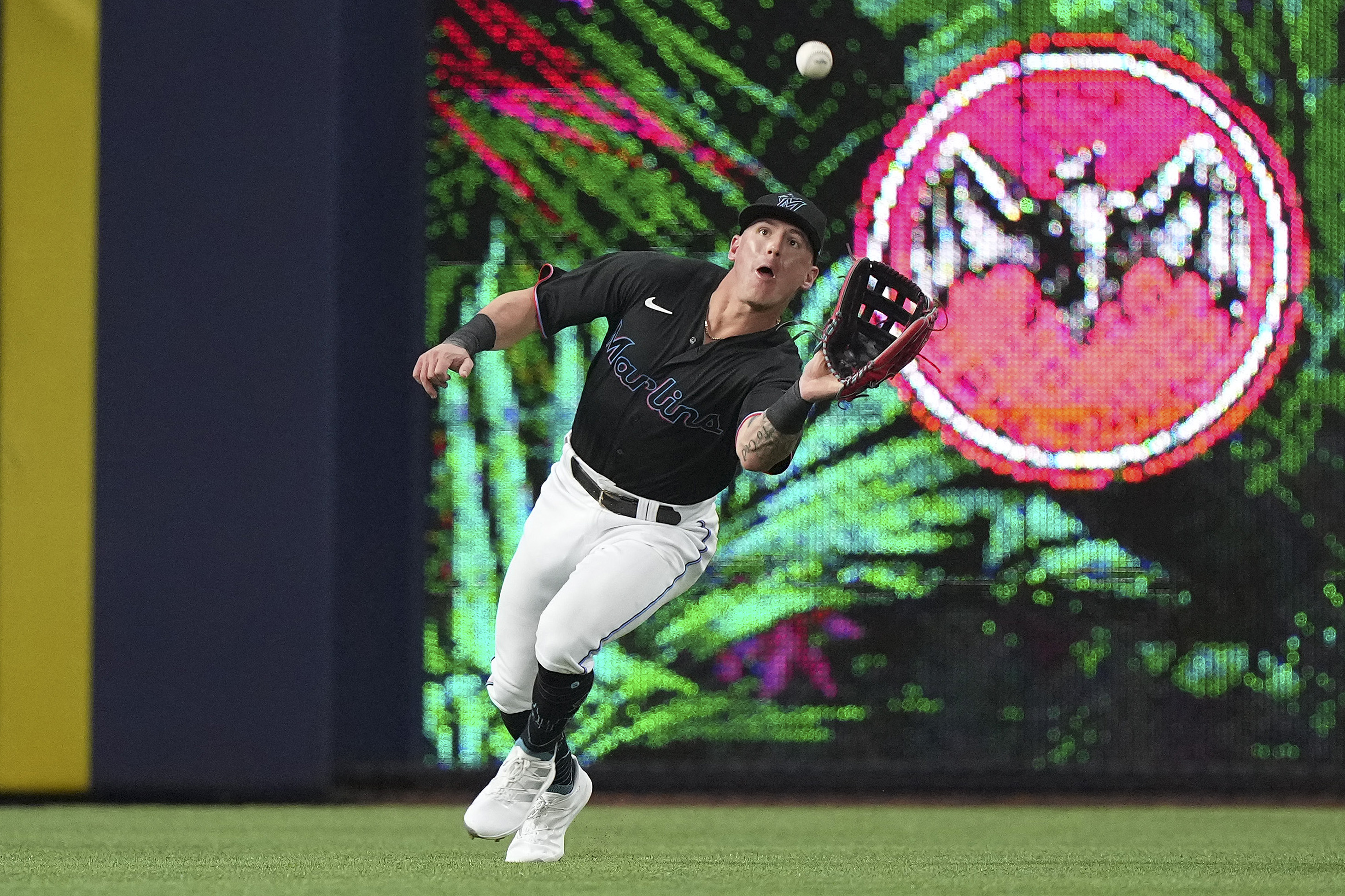 Peyton Burdick #86 of the Miami Marlins catches a fly ball during the fourth inning against the Los Angeles Dodgers at loanDepot park on August 26, 2022 in Miami, Florida.