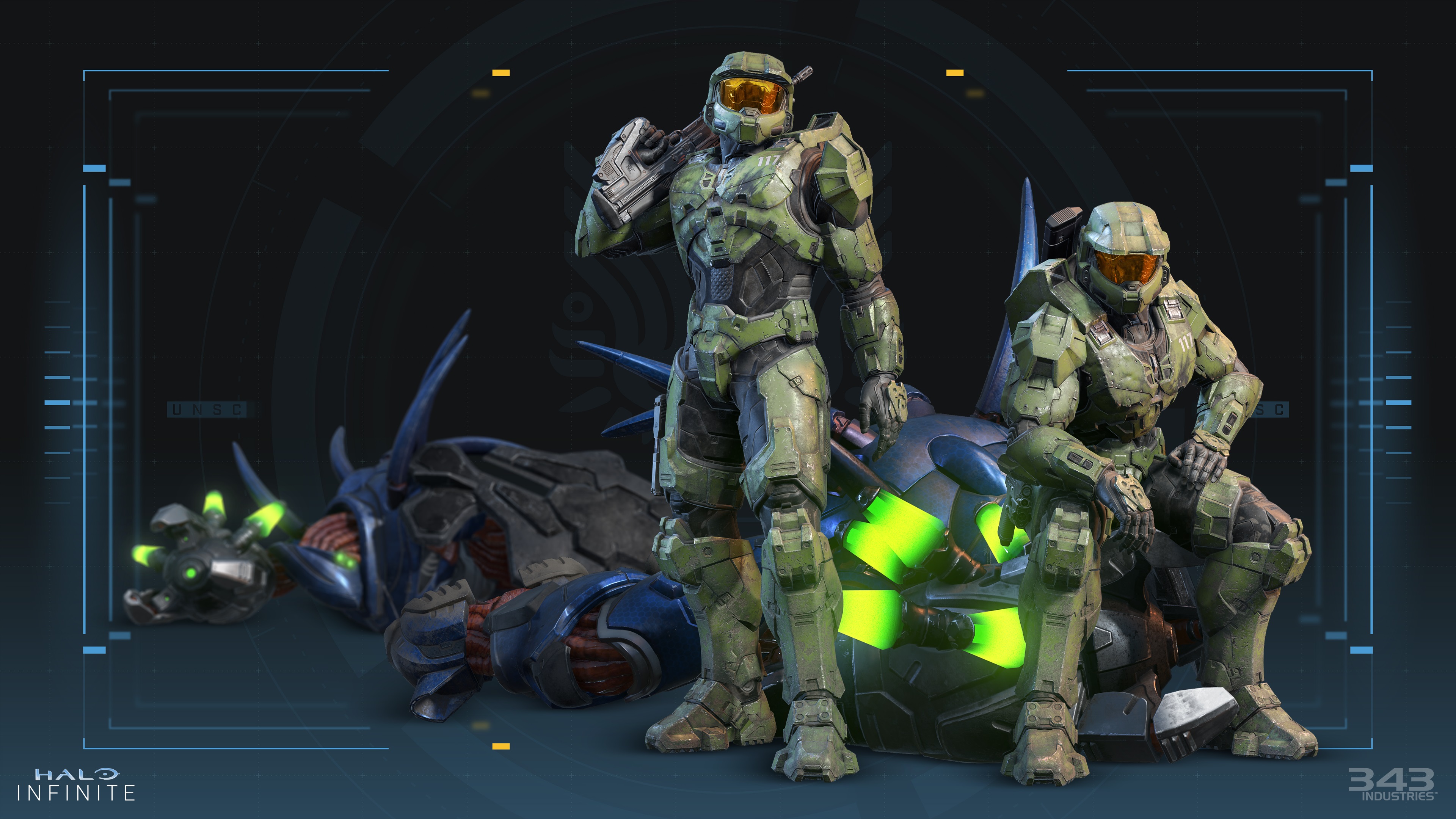 A pair of Master Chiefs, one standing with a gun slung over his shoulder, the other sitting on a fallen enemy, from Halo Infinite