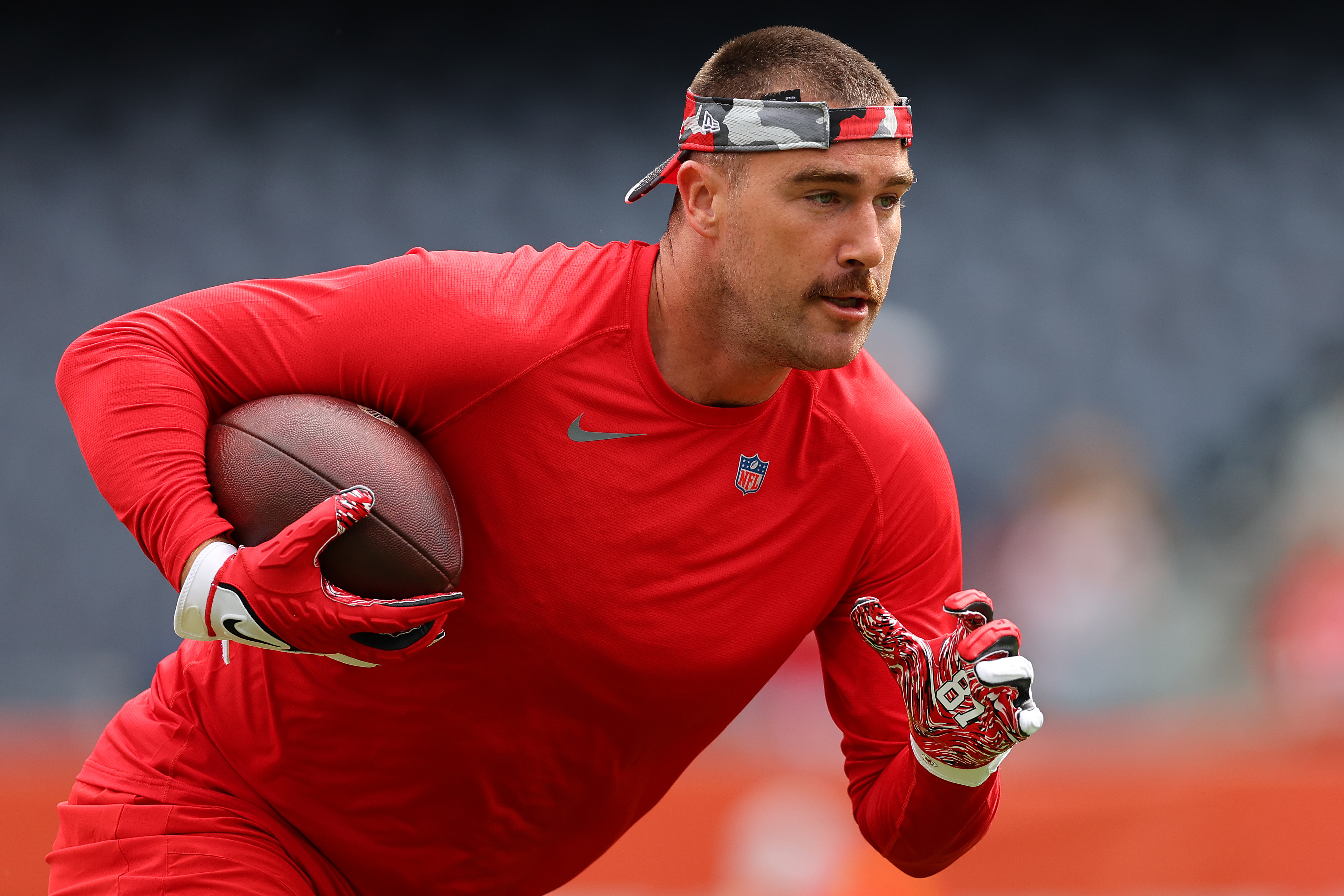 Travis Kelce #87 of the Kansas City Chiefs warms up prior to a preseason game against the Chicago Bears at Soldier Field on August 13, 2022 in Chicago, Illinois.