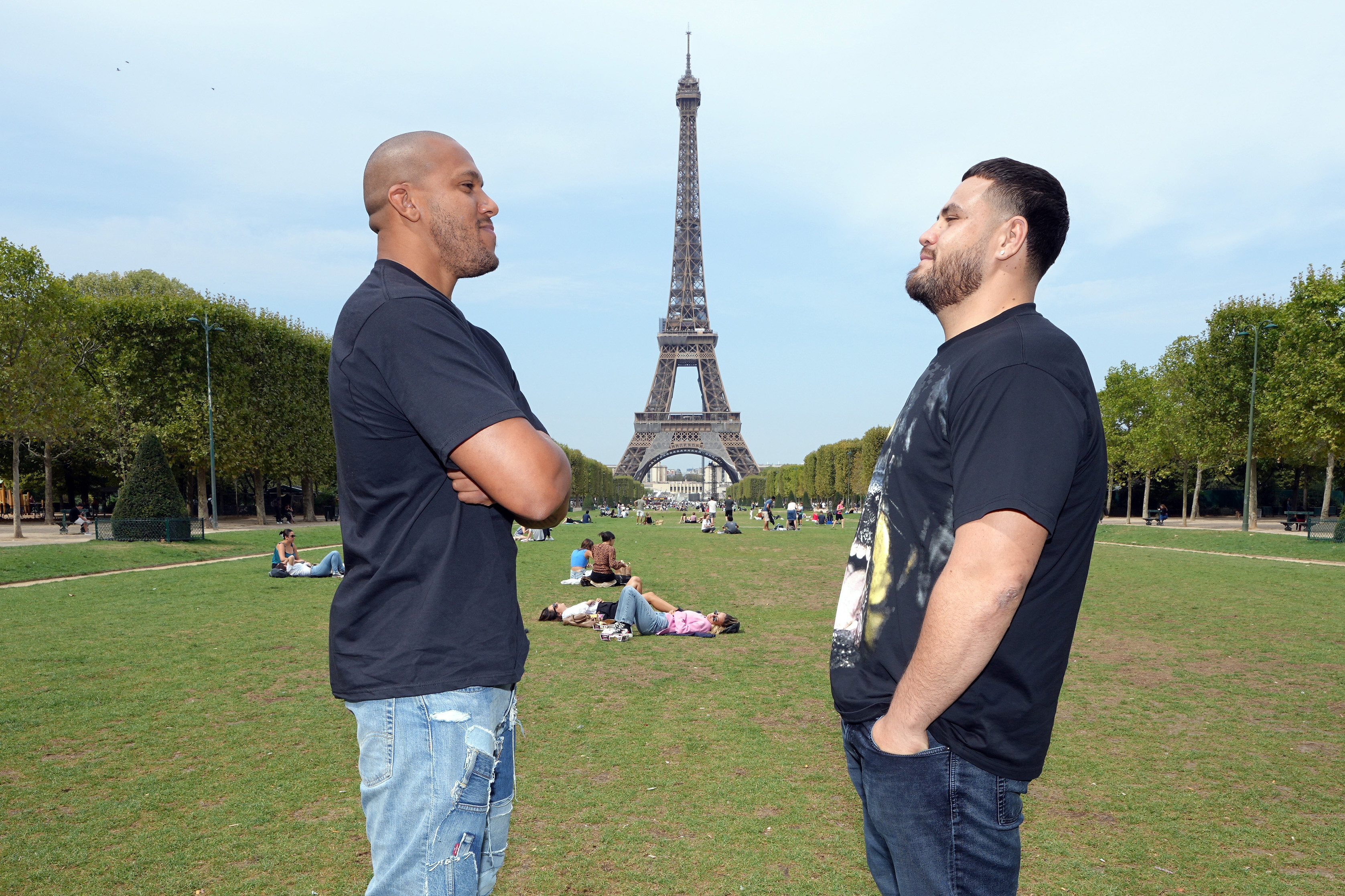 (L-R) Ciryl Gane of France and Tai Tuivasa of Australia face off during a UFC photo session at Champ de Mars on August 30, 2022 in Paris, France.