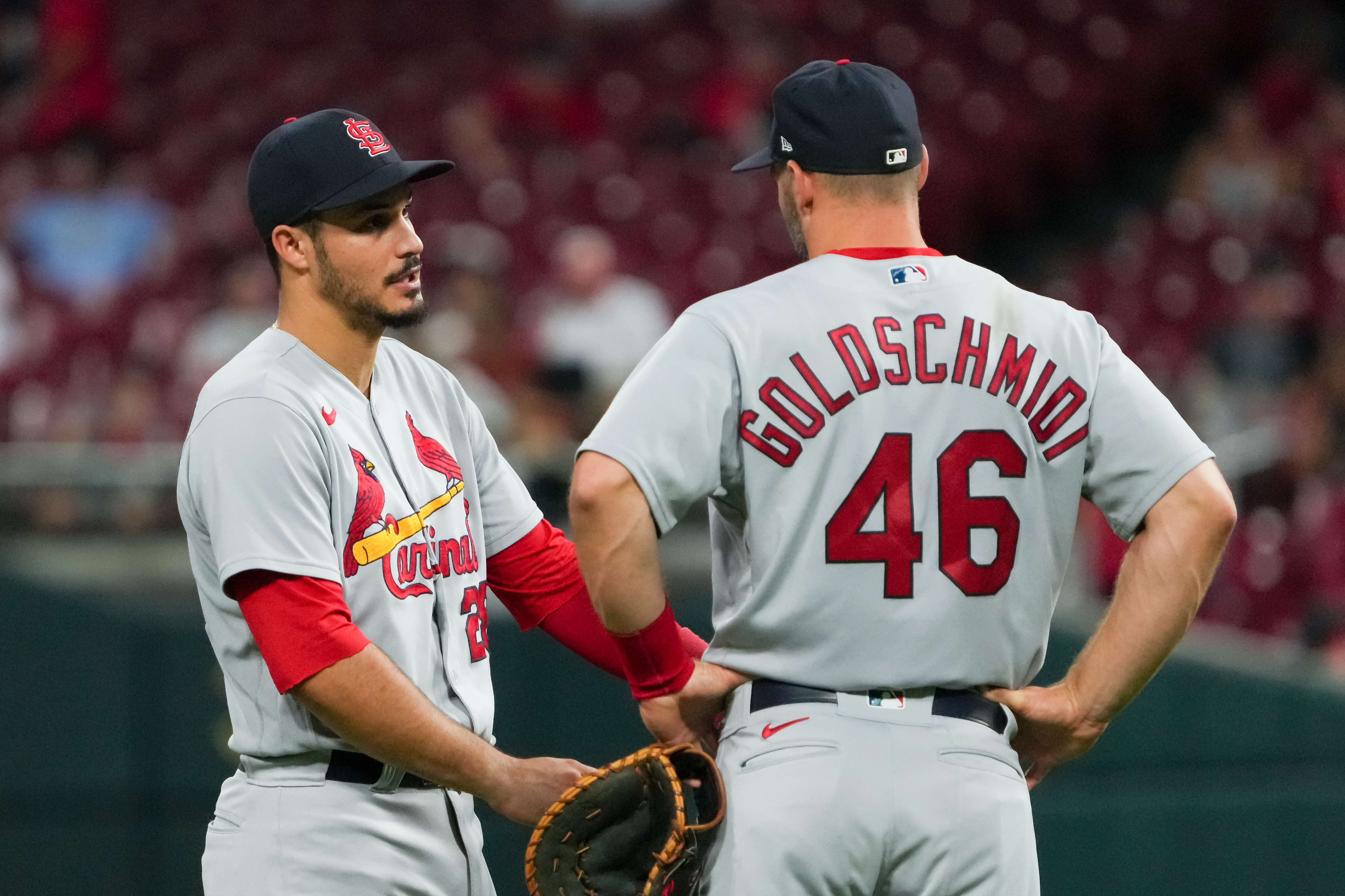 Nolan Arenado #28 and Paul Goldschmidt #46 of the St. Louis Cardinals meet in the fifth inning against the Cincinnati Reds at Great American Ball Park on August 31, 2022 in Cincinnati, Ohio.